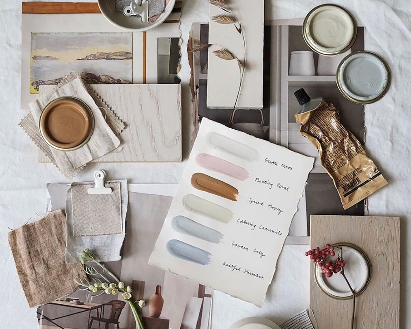 Flat lay of different colours including paint, colour samples and more