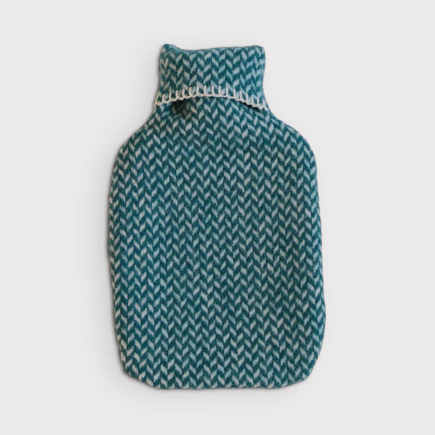 Hot Water Bottle with a knitted pattern cover, crafted from blanket cloth, designed for added warmth and coziness during chilly nights.