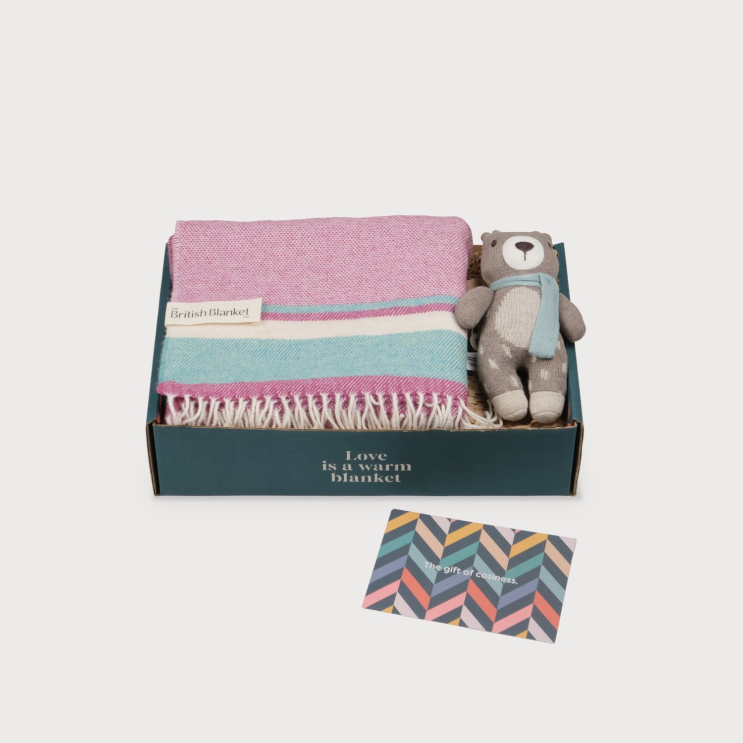 Merino Lambswool Baby Blanket Gift Box: Wilykit includes a striped wool blanket, knitted teddy bear in scarf, and greeting card in a teal box.