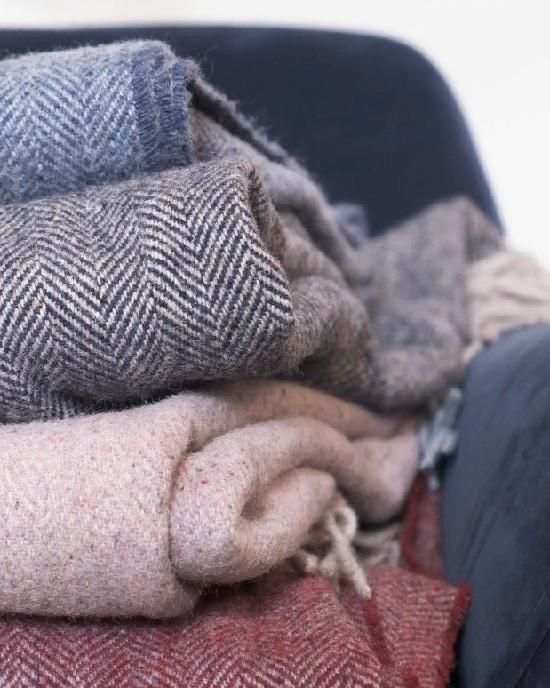 Stack of recycled cashmere blankets from The British Blanket company and Turtle Doves