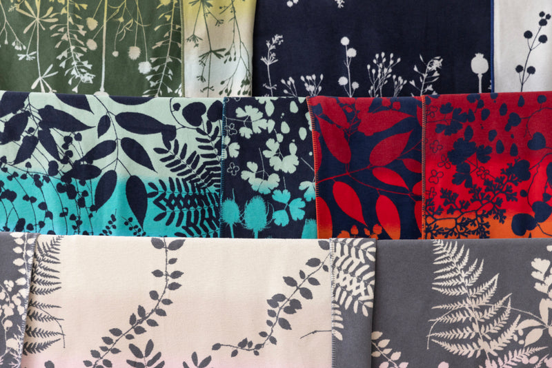 Collection of Clarissa Hulse pattern blankets with various and colours.