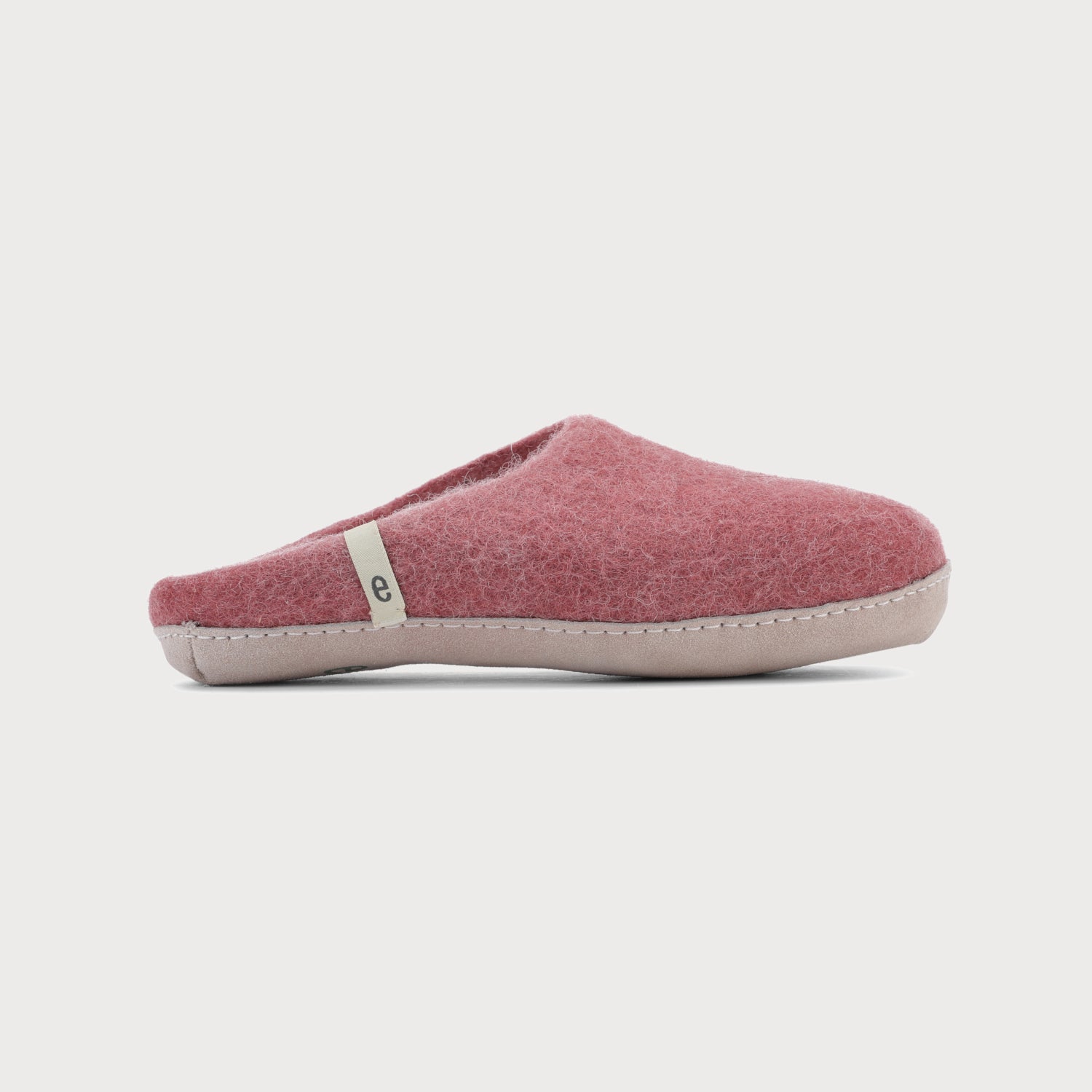 Wool Felt Slippers: Rose, showcasing a red slipper with white trim, close-up of stitching, and a soft suede sole, ideal for indoor comfort.