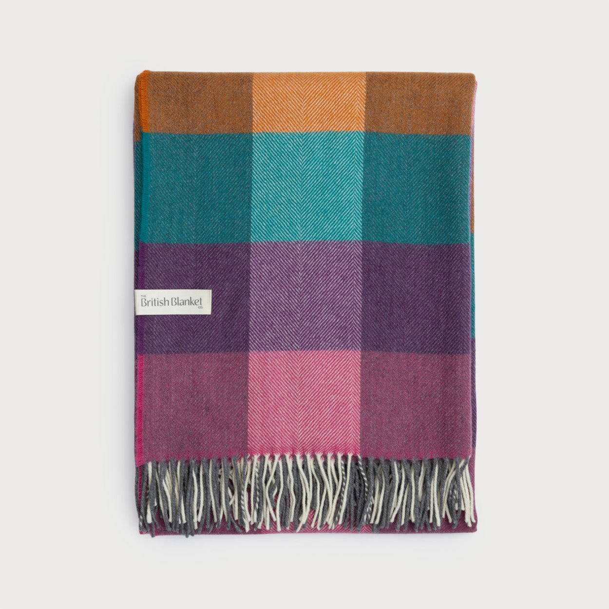 Merino Check Blanket: Hyacinth, a colorful plaid blanket with fringe, featuring a soft merino lambswool weave and a subtle checked pattern.