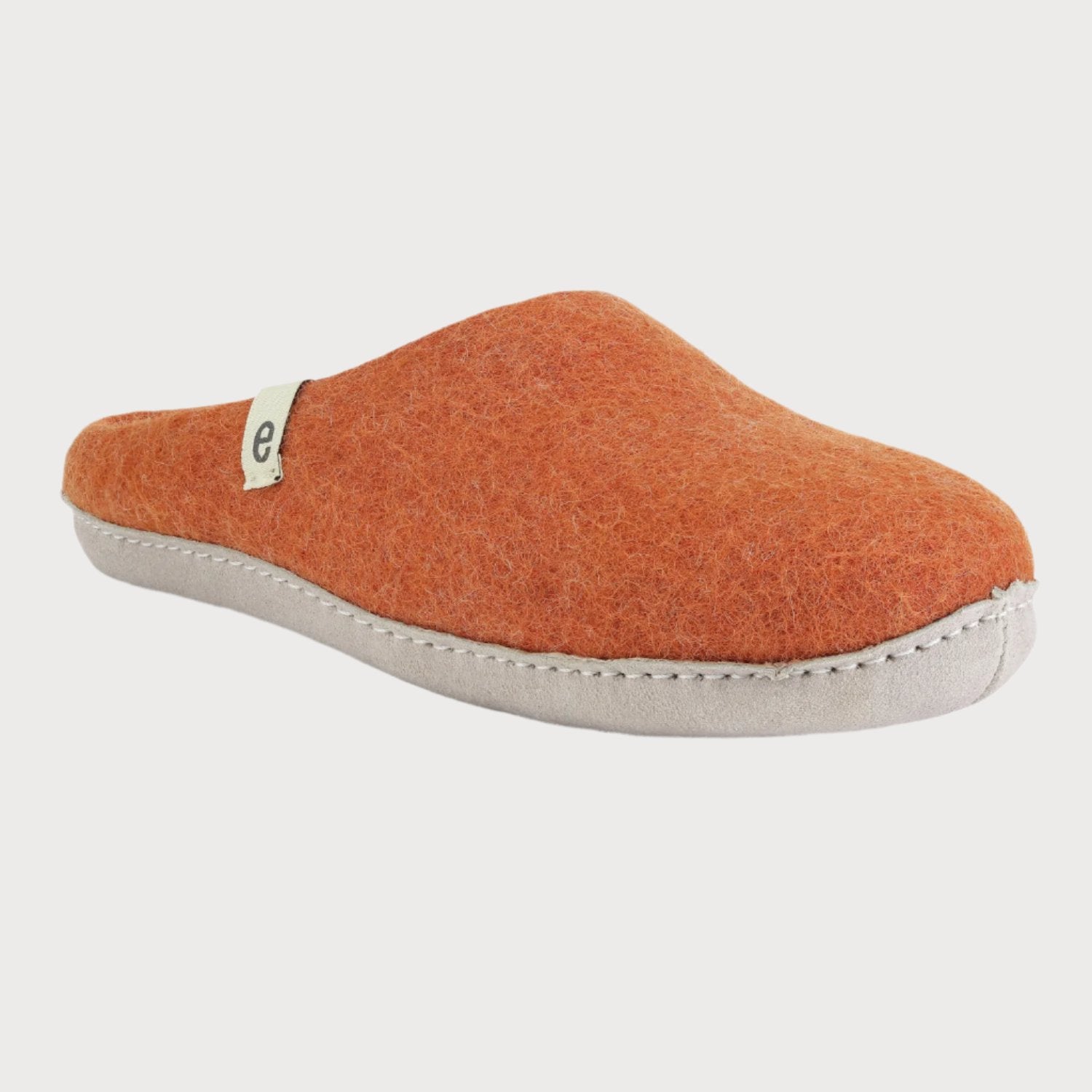 Close-up of Wool Felt Slippers: Clay, highlighting the detailed felt texture and cushioned suede sole, handcrafted in Nepal for indoor comfort.