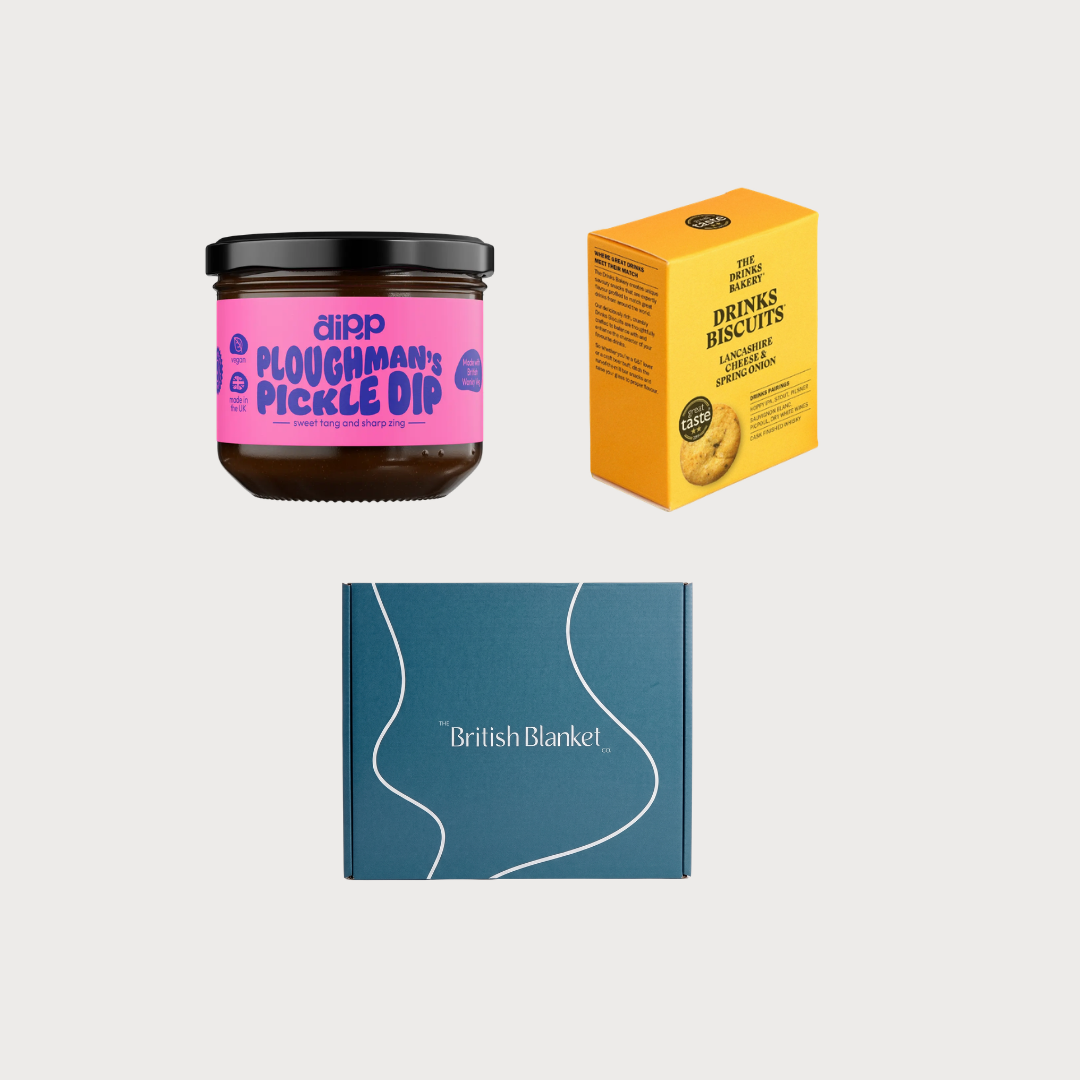 Picnic Gift Box Bundle with Ploughman’s Pickle Dip, Lancashire Cheese Biscuits, and a blanket from The British Blanket Co. in a teal gift box.