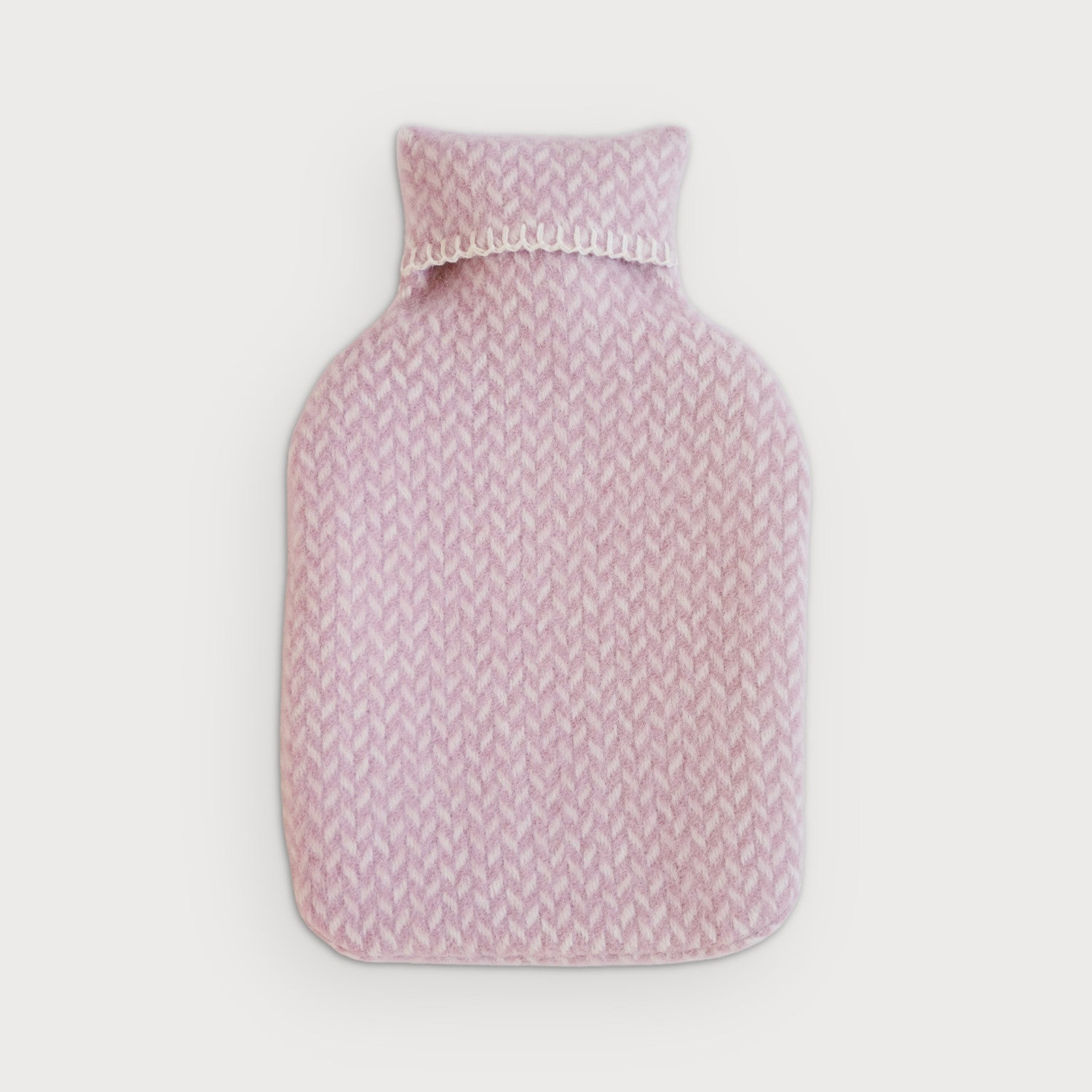 Hot Water Bottle with a huggable wool cover, designed for added warmth in a blanket gift box. Ideal for staying cozy on chilly nights.