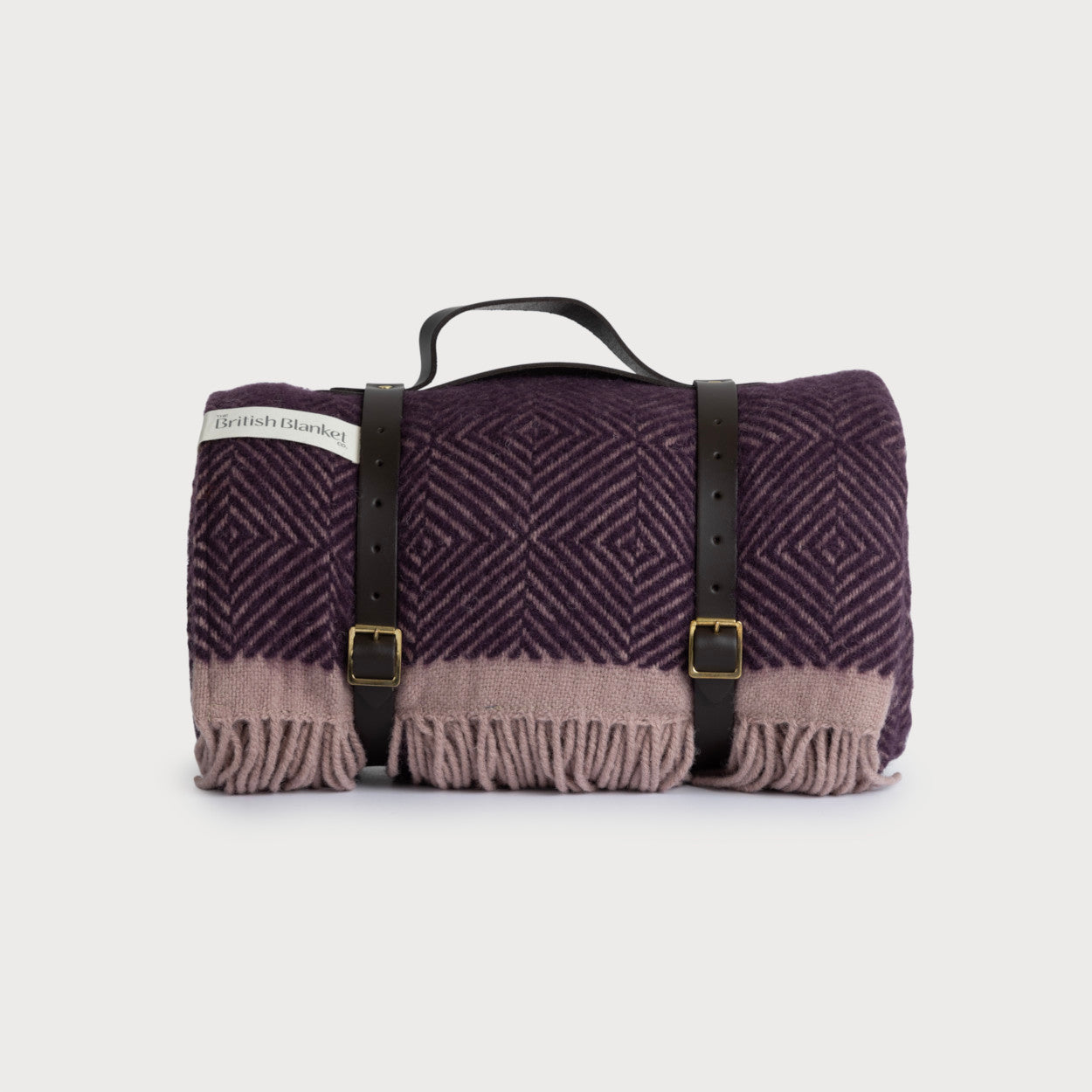 Waterproof Picnic Blanket: Blackberry and Heather, featuring a leather carry strap and visible black buckle, ideal for outdoor use with its waterproof backing.