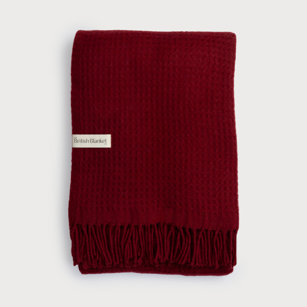Totterdown Waffle Blanket: Air Balloon (B) features a folded waffle-weave design with knotted fringe, and a label reading “The British Blanket Co.”