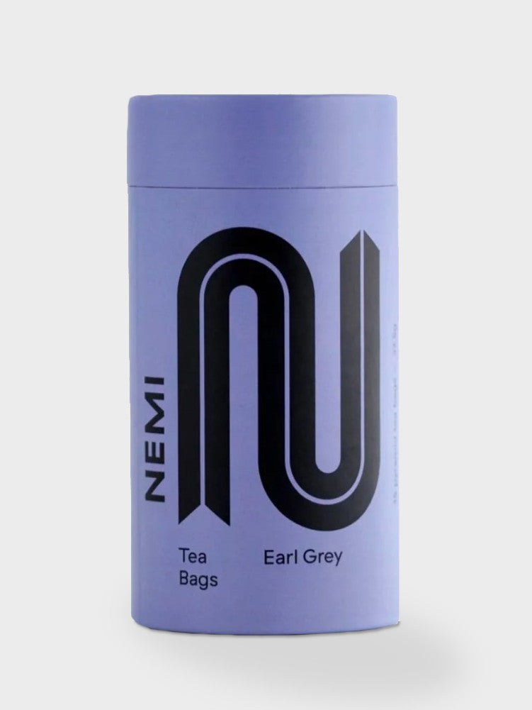Organic Tea box featuring Nemi's fair trade, compostable tea bags, designed to relax and revive. Includes English Breakfast, Earl Grey, and Peppermint varieties.