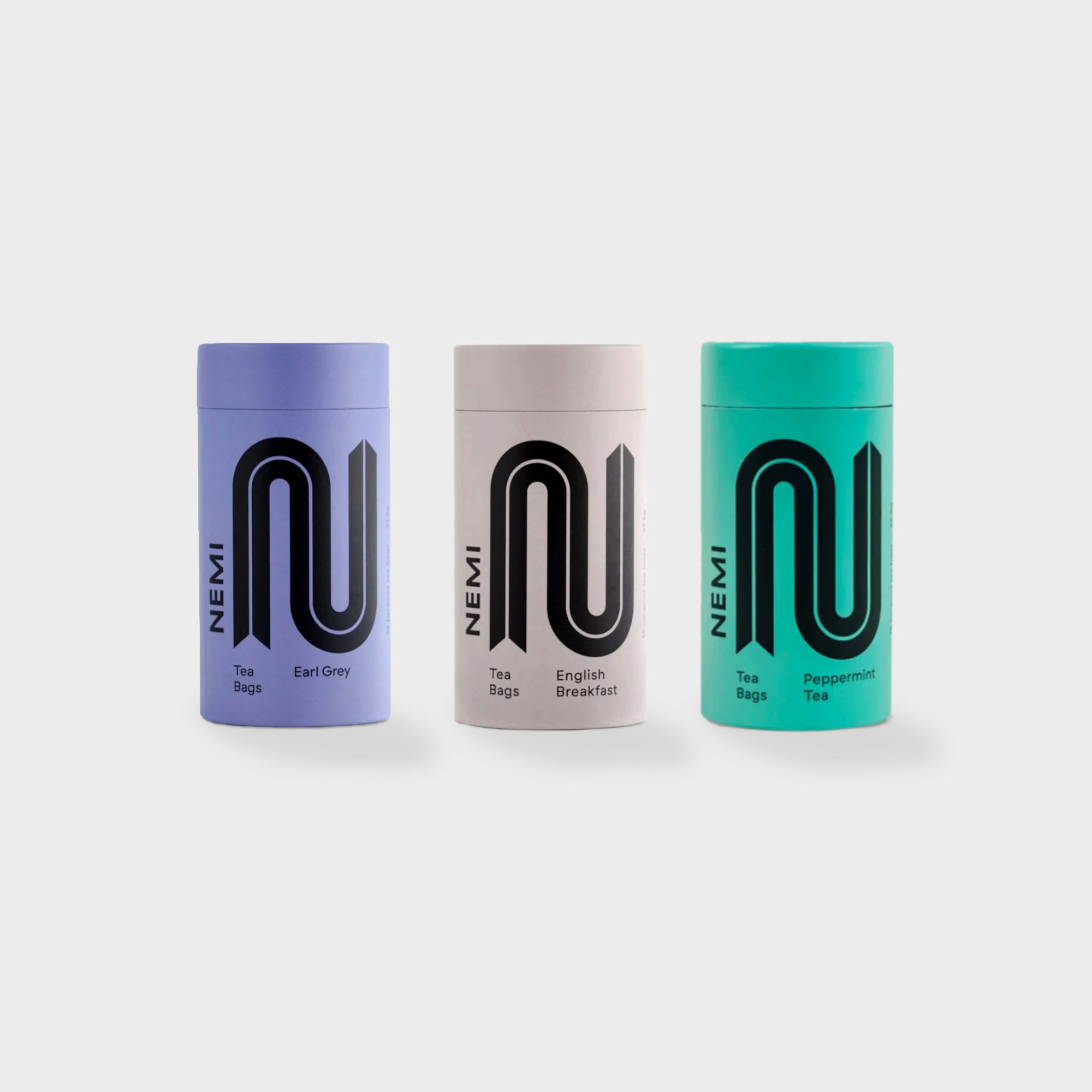 Organic Tea gift box featuring a colorful tube of Nemi luxury tea with 15 compostable bags, promoting relaxation and employment opportunities for refugees.