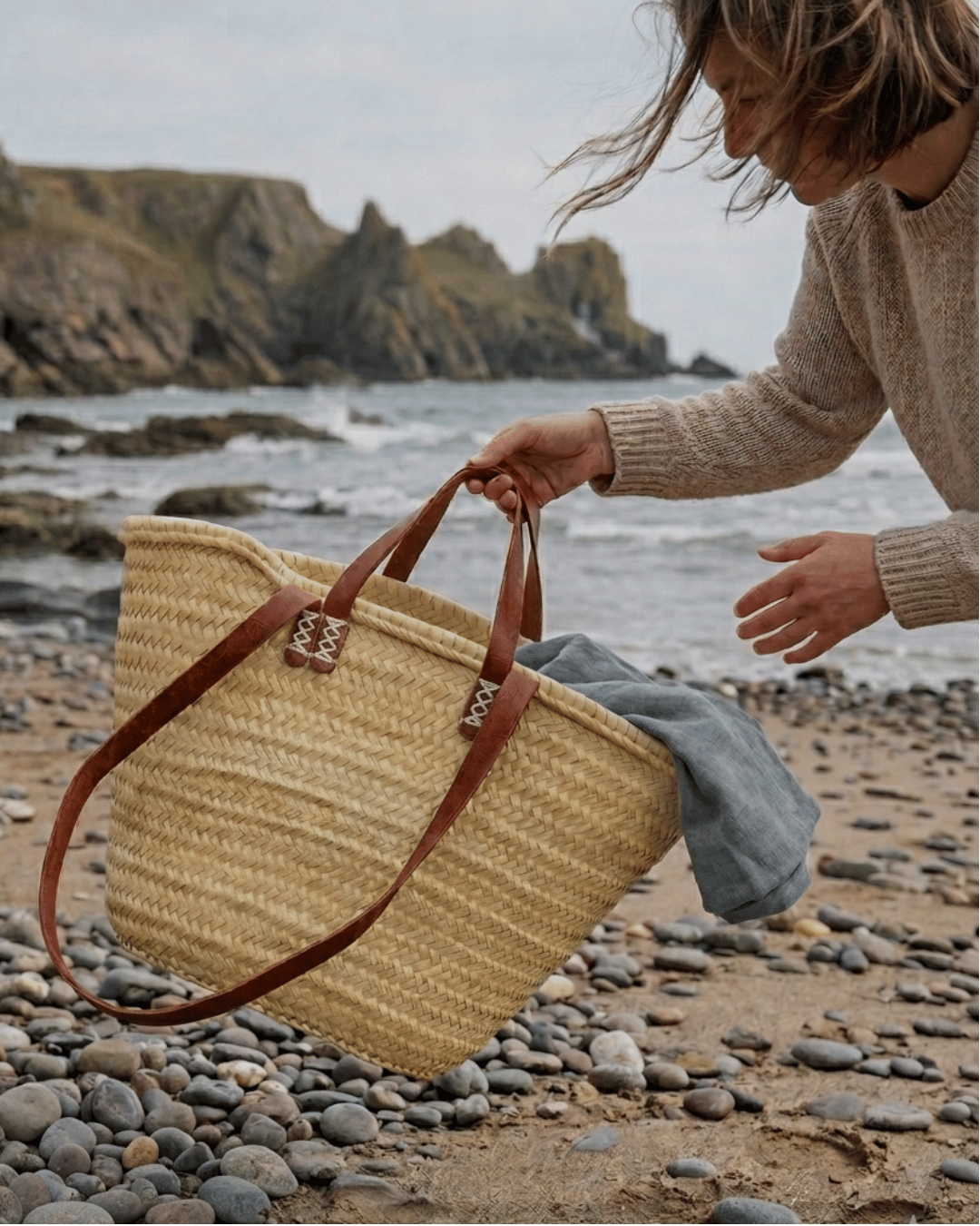Straw bag for beach breaks, picnic days and summer city escapes with leather carry strap and handles.
