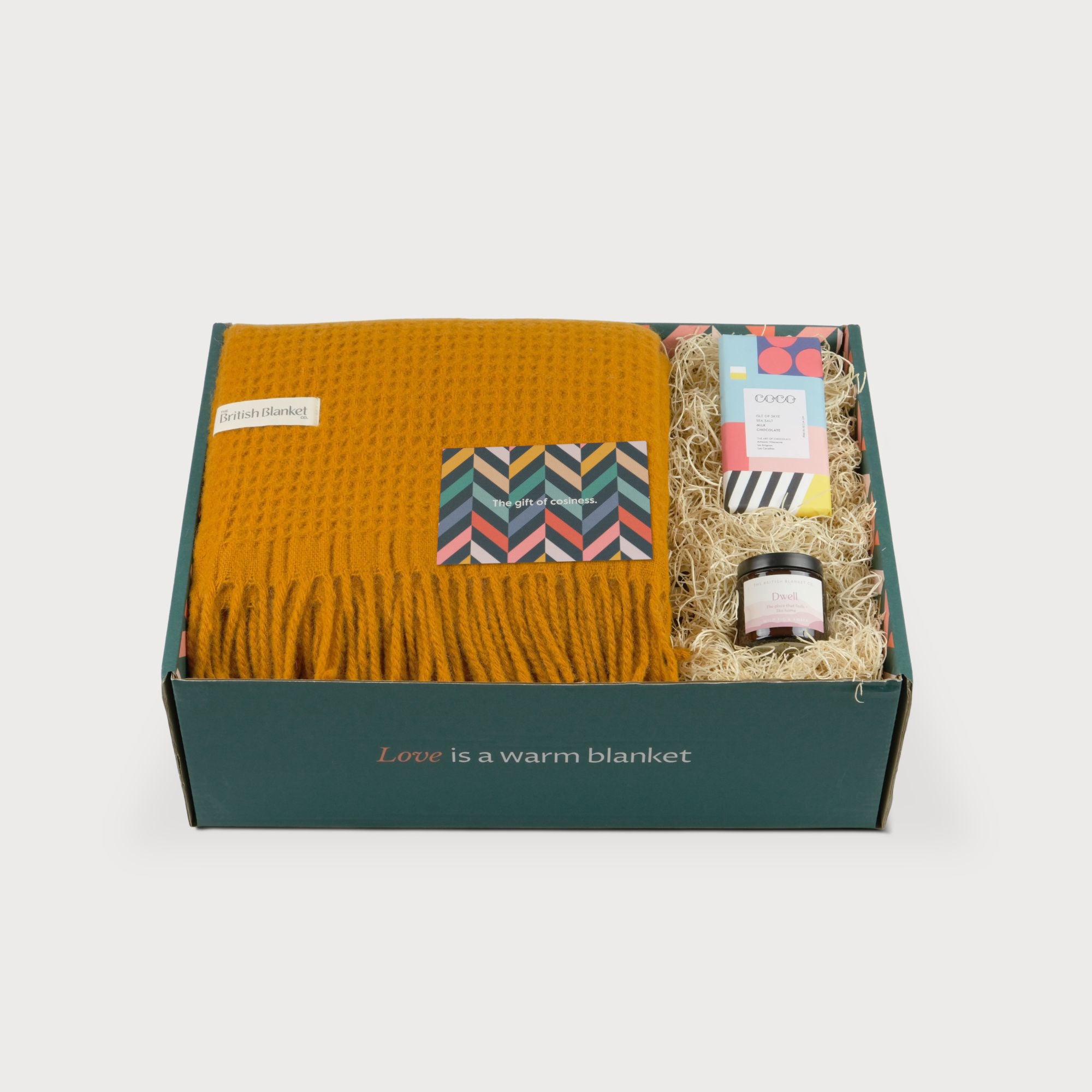Totterdown Blanket Gift Box: Ashton includes a British Blanket throw, chevron card, speciality chocolate, and Dwell jar, all arranged in a teal box.