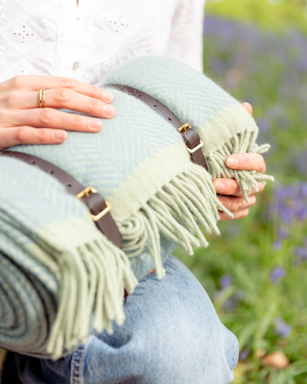 Waterproof Picnic Blanket: Sea Holly and Lichen, featuring handmade wool with leather straps and waterproof backing, ideal as a high-quality travel rug gift.