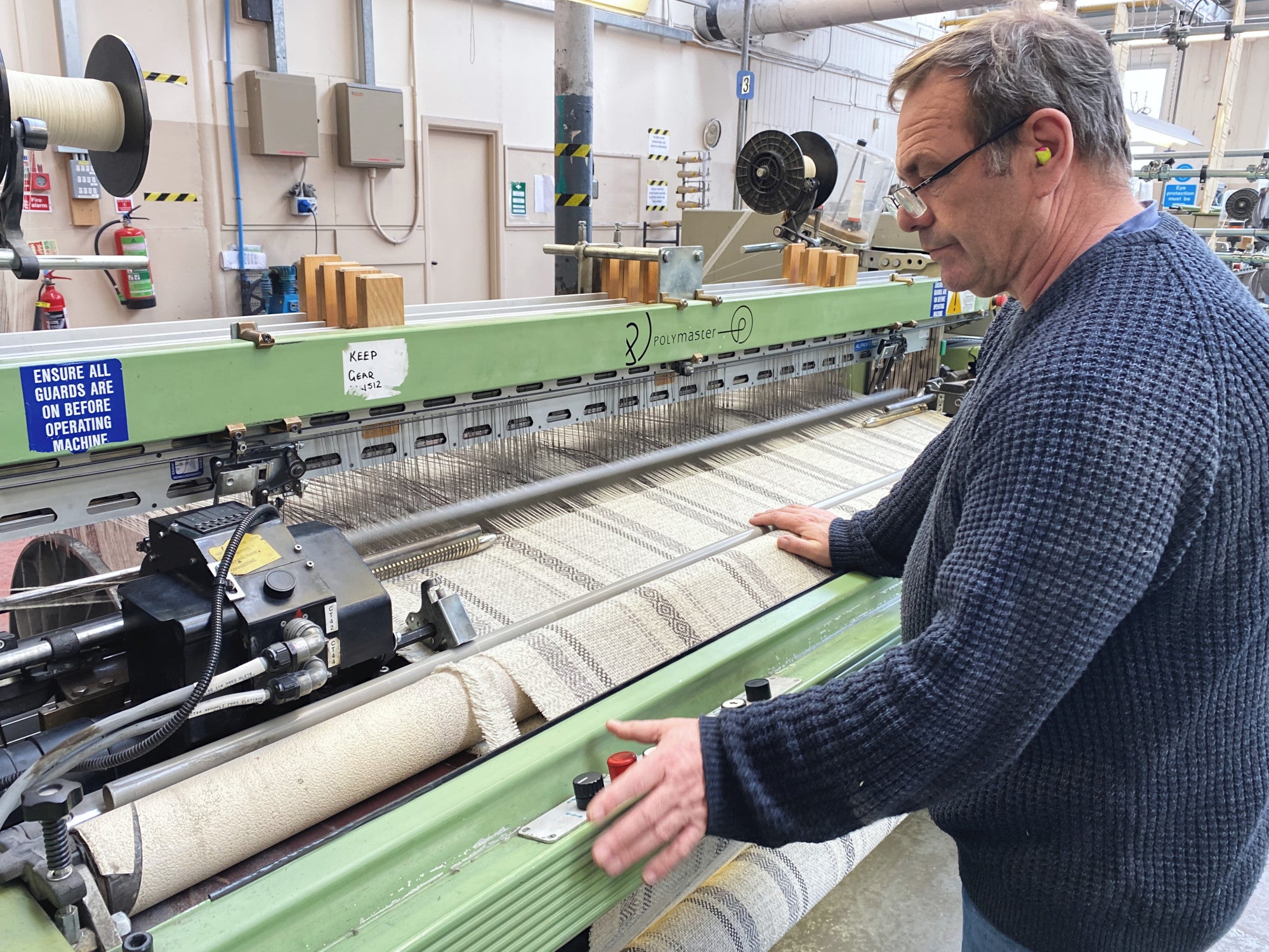 Man operating a weaving loom The British Blanket Company