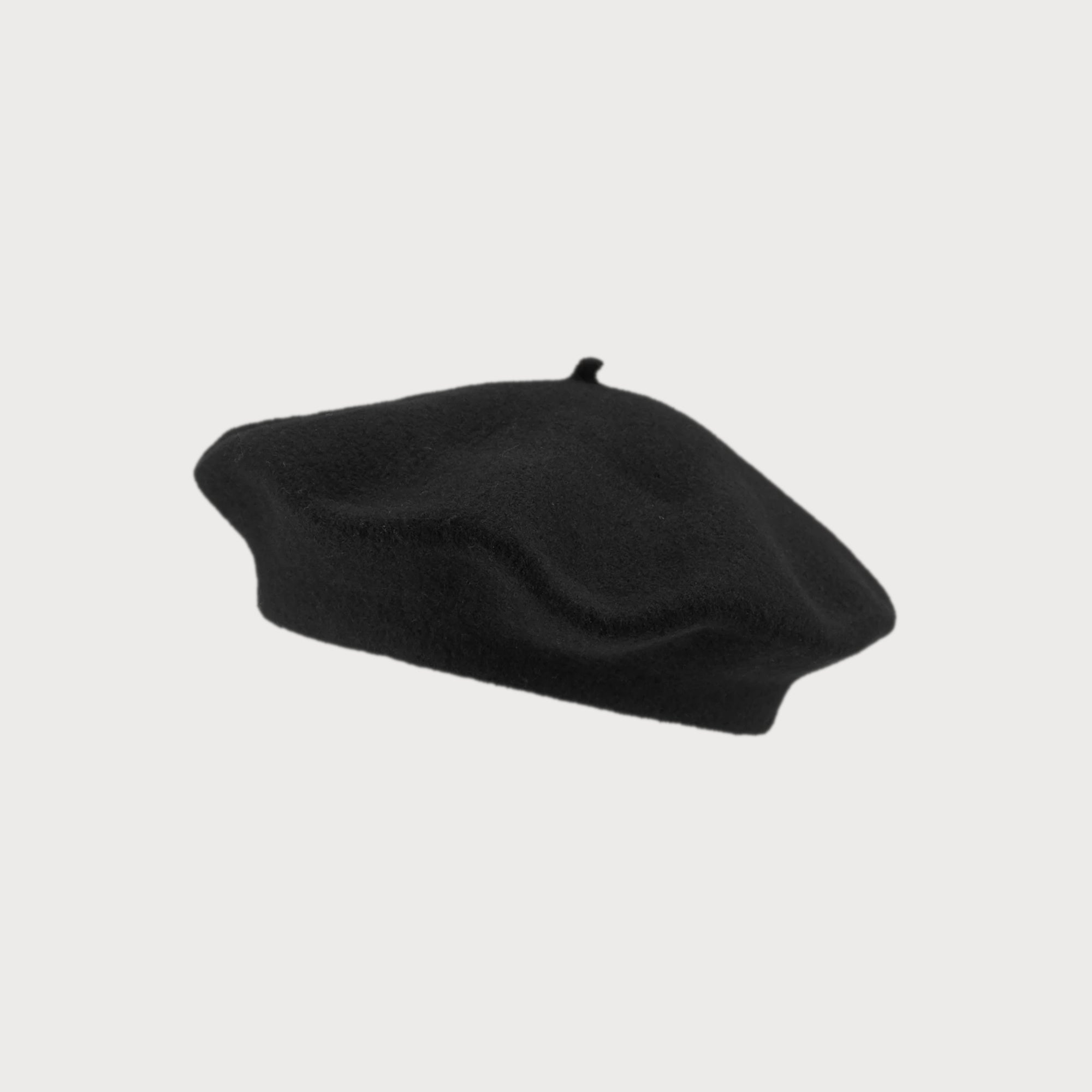 Wool Beret Hat: Black - Classic round, flat-topped design in thick felt, providing warmth and breathability. One-size fit, ideal for pairing with scarves.