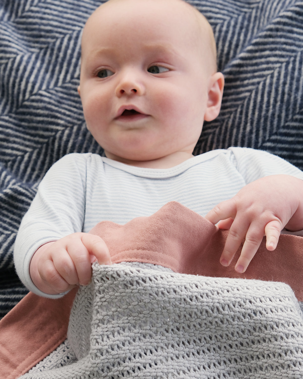 Organic Cotton Cellular Baby Blanket: Russet, showcasing a textured, breathable design, made from soft organic cotton with a contemporary trim, ideal for regulating a baby's temperature.