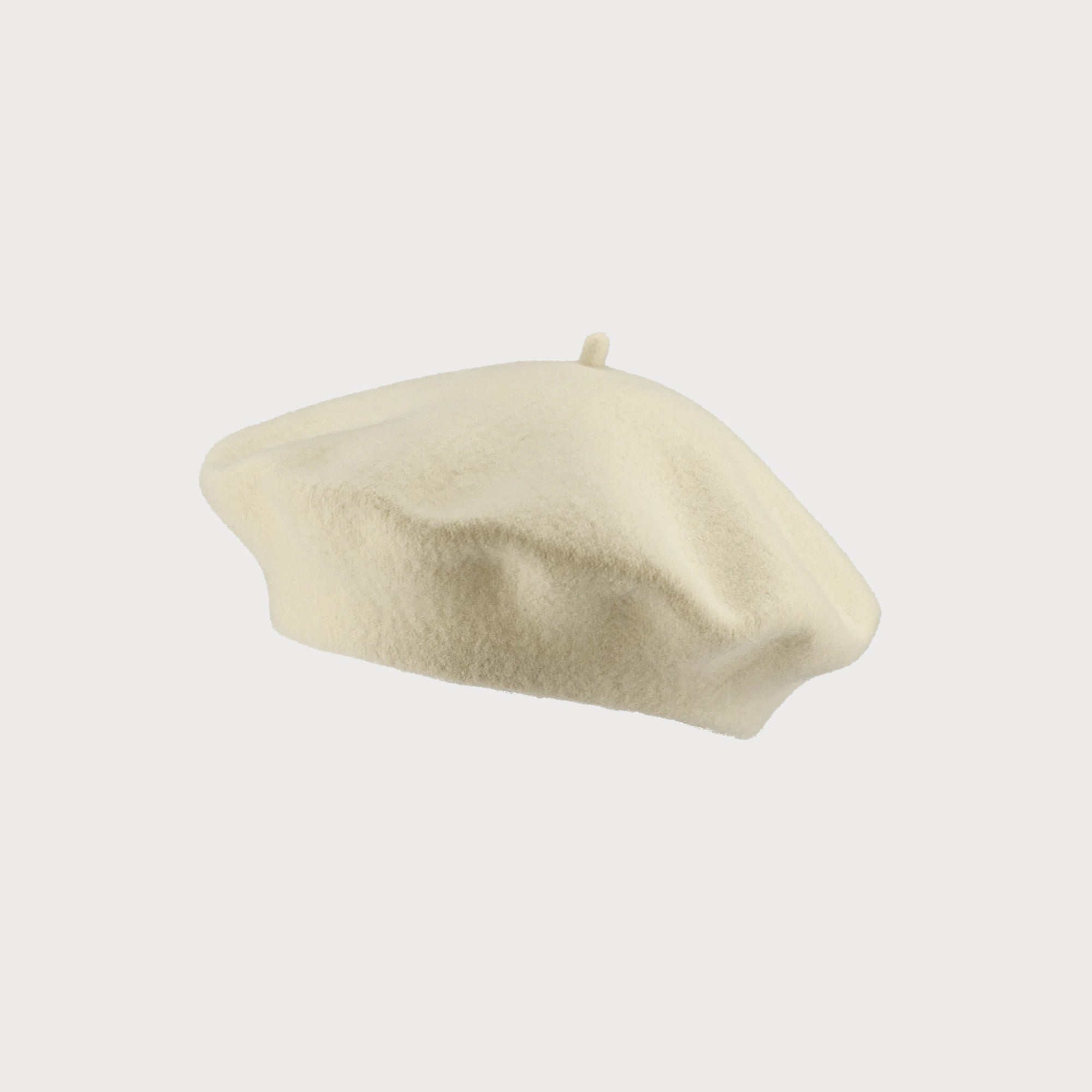 Cream Wool Beret Hat, expertly knitted in a round, hand-felted for shape retention, offering breathable warmth with a thicker wool texture, maximum circumference 58cm.