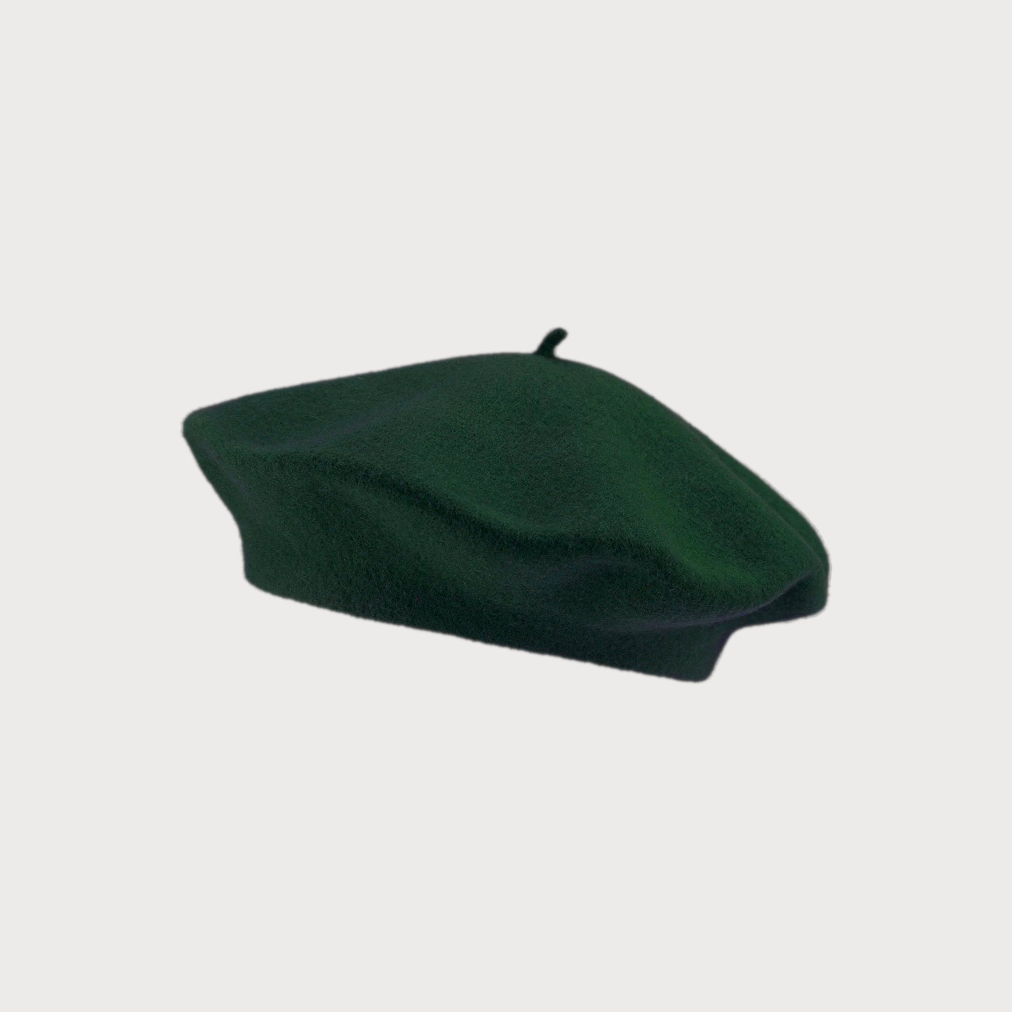 Wool Beret Hat: Dark Green featuring a soft, round shape, crafted from thick, durable wool, shown on a plain white background.