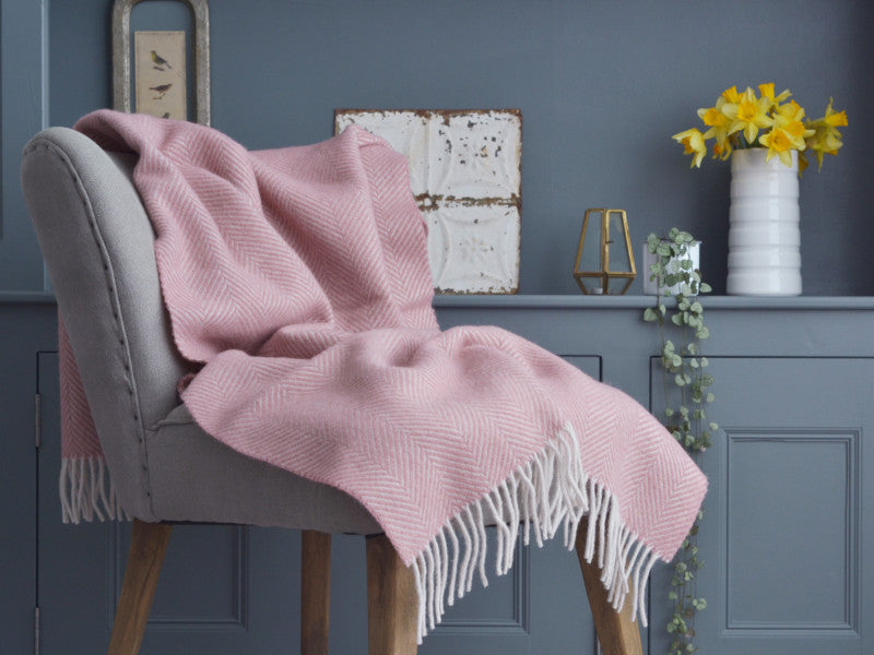 pink wool blanket on a chair