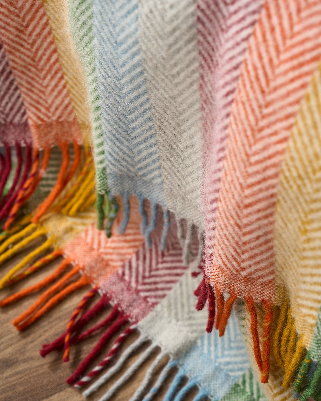 Waterproof Picnic Blanket: Bright with rainbow stripes, fringes, and leather straps. Ideal for outdoor use with waterproof backing. Perfect for picnics and gifts.