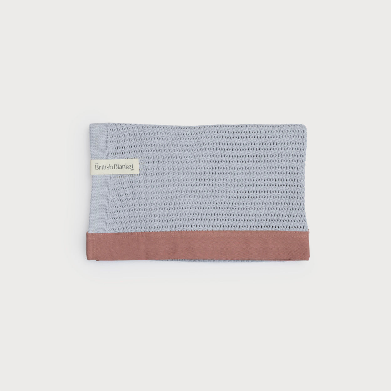 Organic Cellular Baby Blanket: Russet, crafted from skin-kind organic cotton with contemporary trim, shown in a close-up view highlighting its breathable, lightweight fabric.