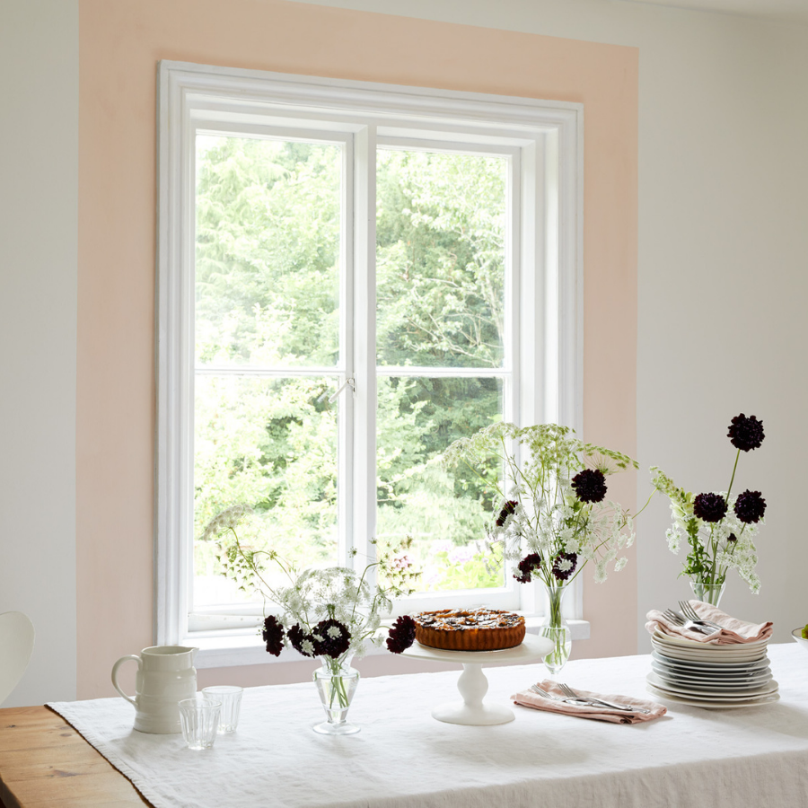 Here, delicate off-white walls painted in Earthborn’s Up Up Away are complemented by a strip of Peach Baby, perfectly highlighting a feature window