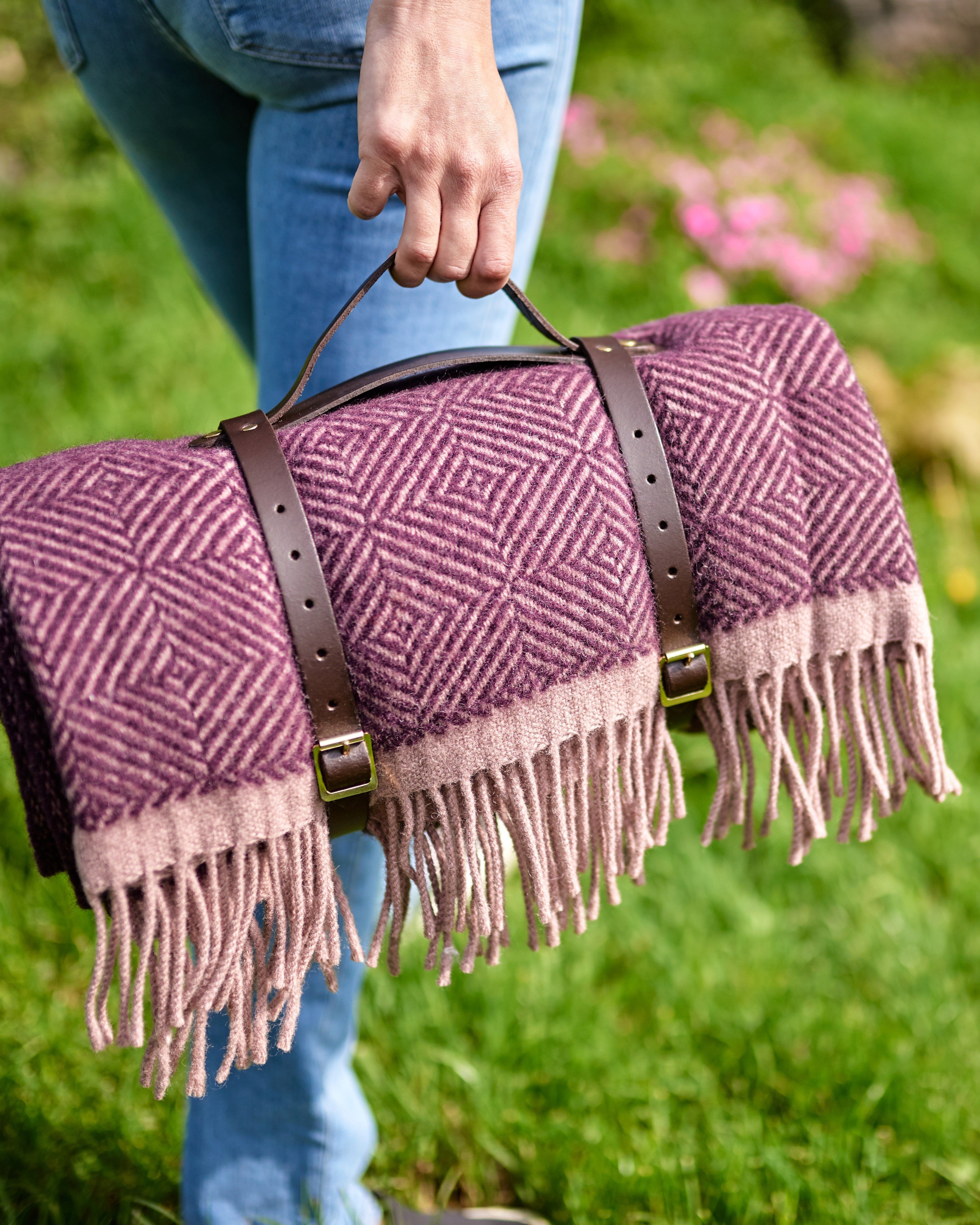 Waterproof Picnic Blanket: Blackberry and Heather, handcrafted in the UK, features leather carry straps and a waterproof backing, ideal for outdoor use.