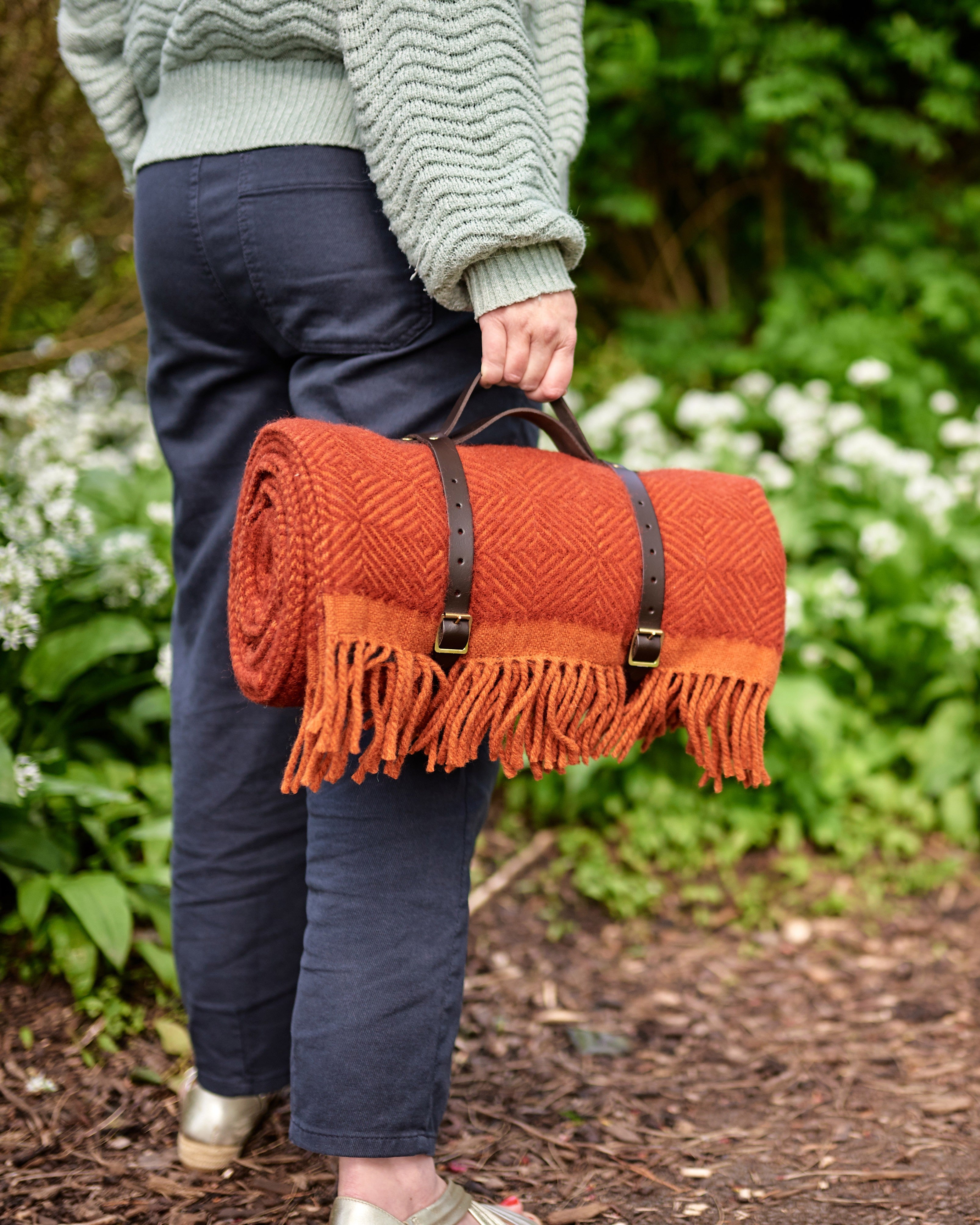 Waterproof Picnic Blanket: Rowan and Beech, showcasing leather straps and a waterproof backing, ideal for outdoor use. Crafted in the UK, perfect for gifting.