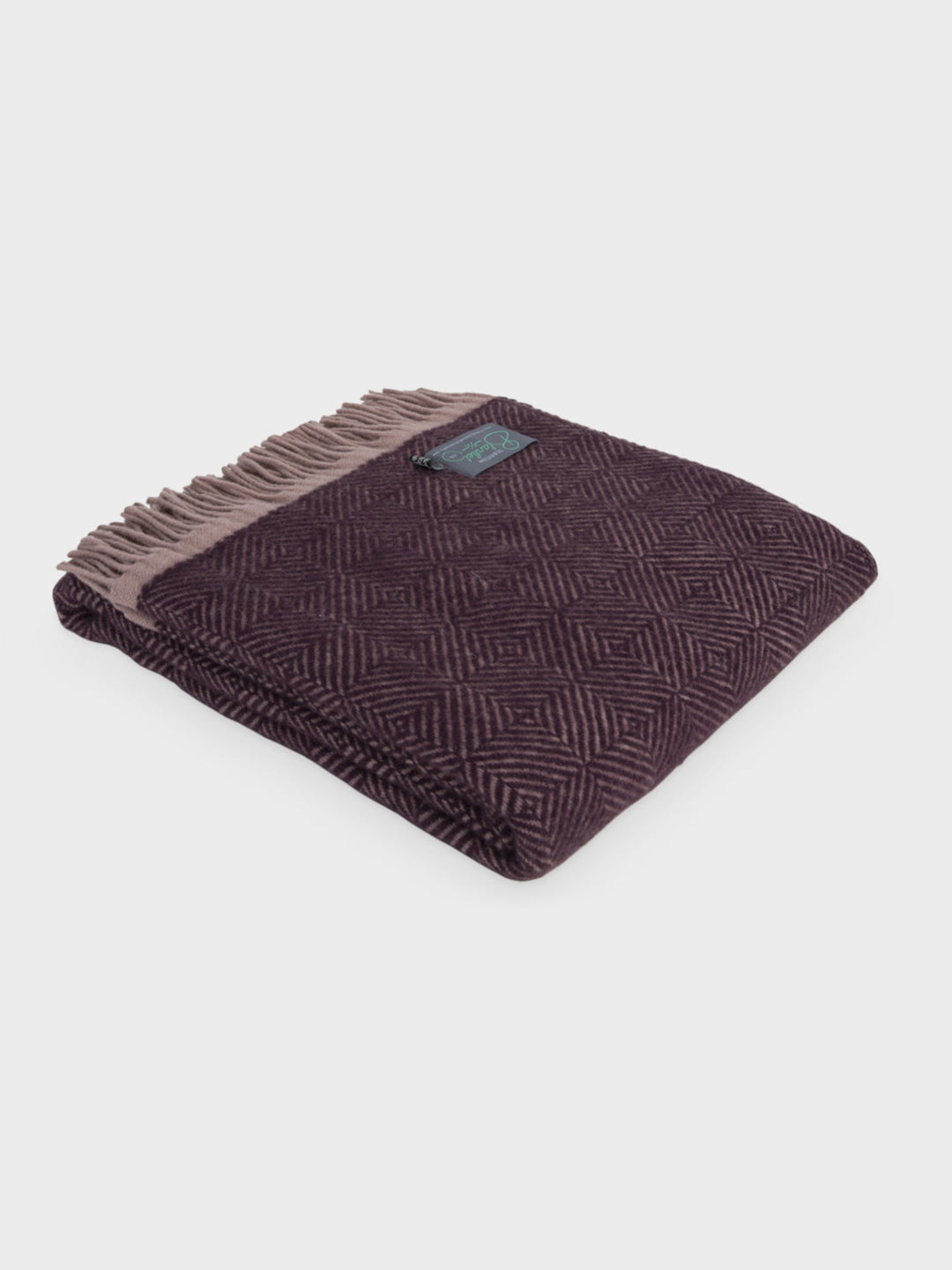 A folded purple Wildweave wool throw by The British Blanket Company.
