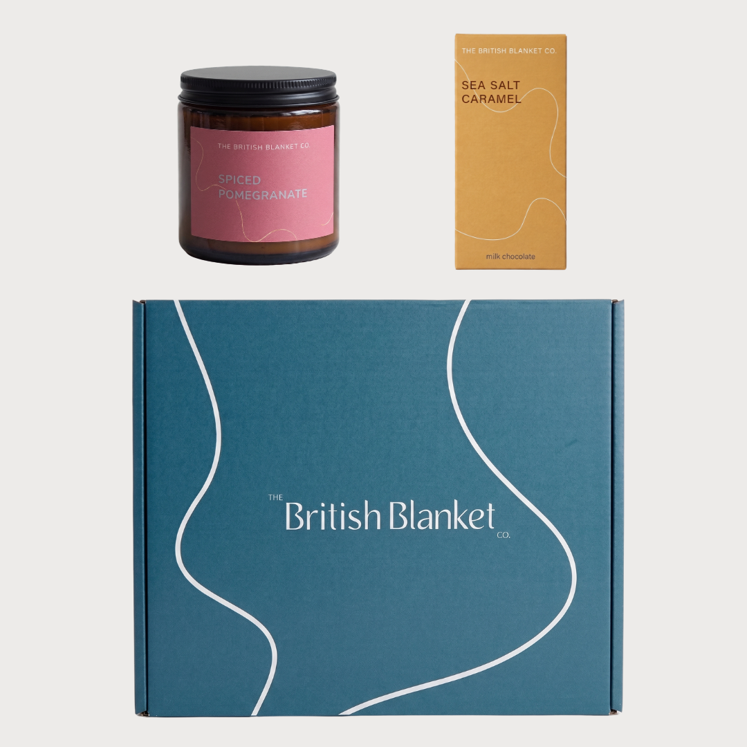 Blanket Gift Box Bundle featuring a Spiced Pomegranate candle, Sea Salt Caramel chocolate bar, and a branded gift box from The British Blanket Co.