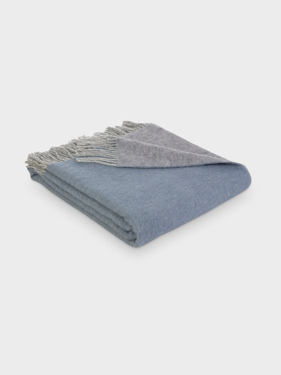 Folded blue and grey reversible wool throw blanket by The British Blanket Company