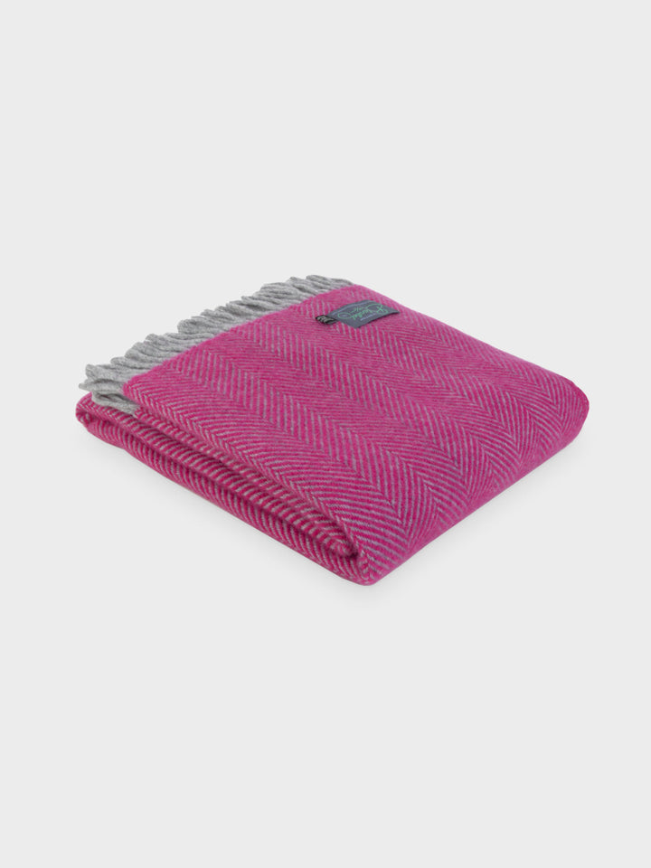 Folded Bright Pink and Grey Herringbone Throw by The British Blanket Company