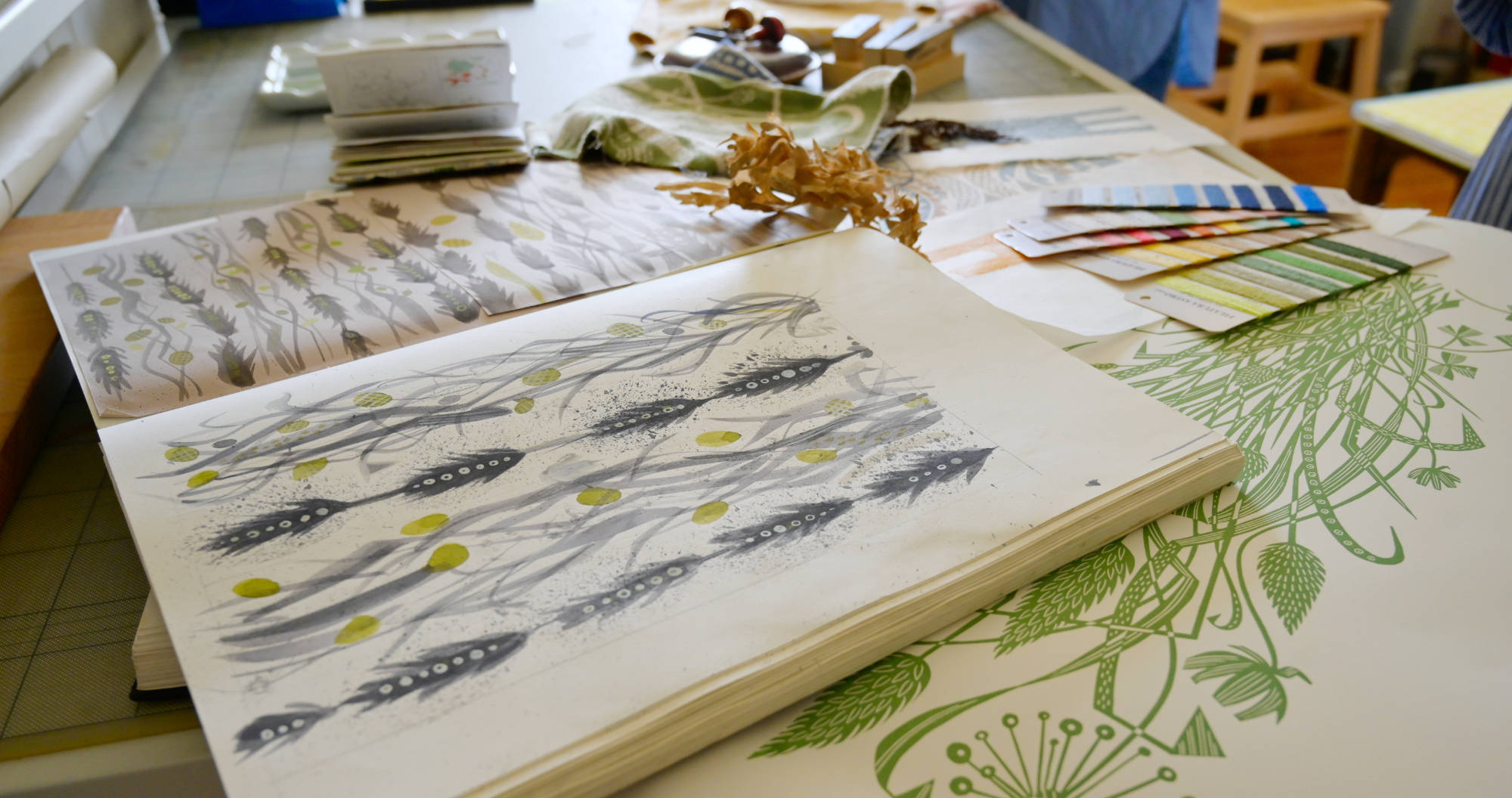 Angie Lewin's Sketchbook containing watercolor paintings of fauna and wheat.
