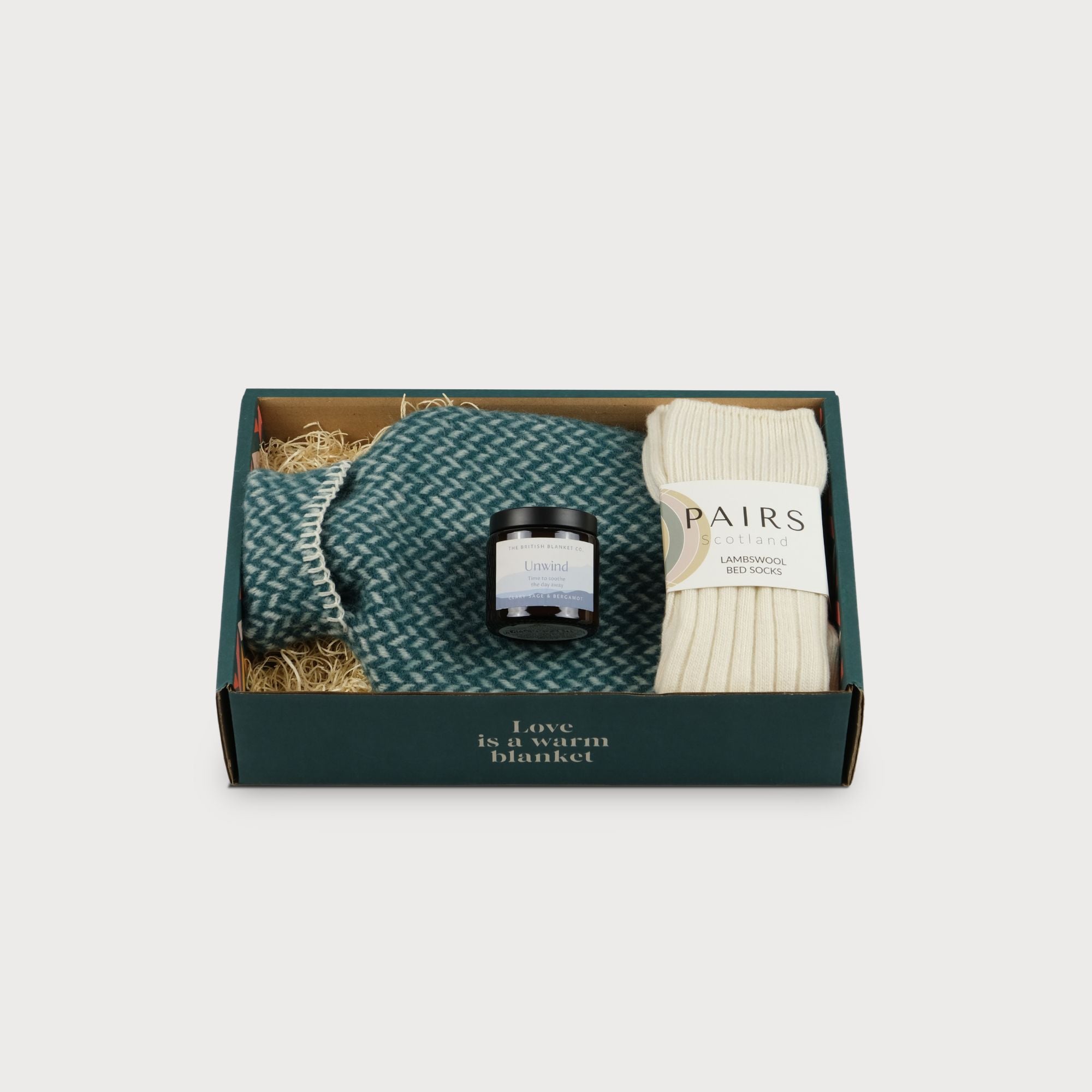 Cosy Gift Set: Restful, featuring a sign with white text on the eco-friendly box, ideal for gifting with a handmade mug, candle, and organic tea.