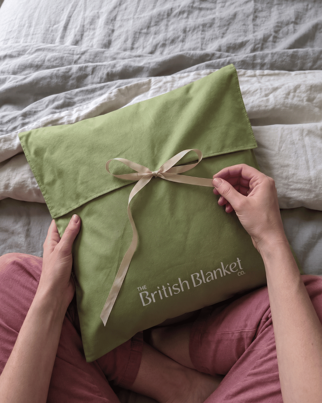 Green cotton gift bag with ribbon to accompany your blanket. 