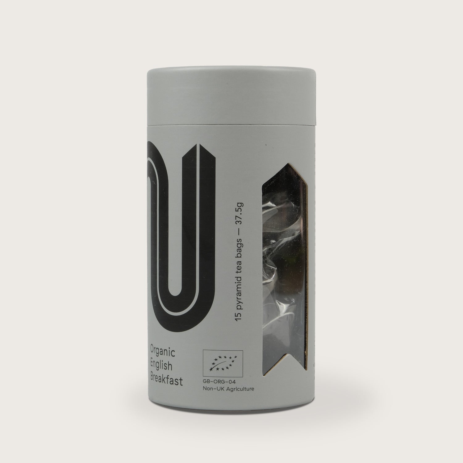 Cosy Gift Box: Me Time, featuring a close-up of a tin can with text, presented alongside a plastic bag and a striped background.