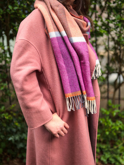 woman wearing Beetroot and Orange Merino Wool Oversized Blanket Scarf