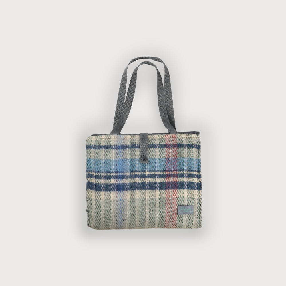 Recycled wool picnic blanket with long webbing straps and pocket
