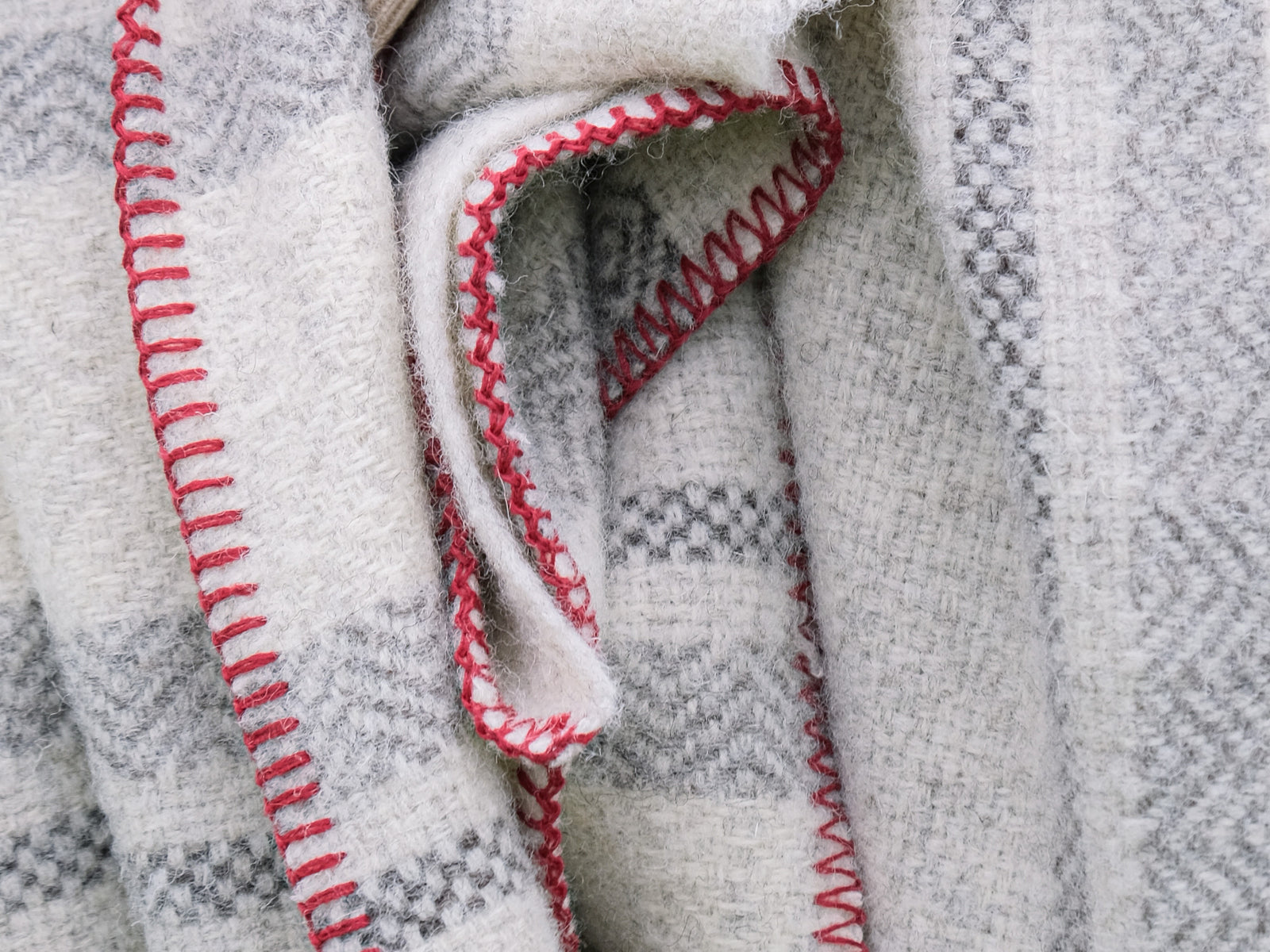 Blanket stitch edging. red thread on British Wool Blanket