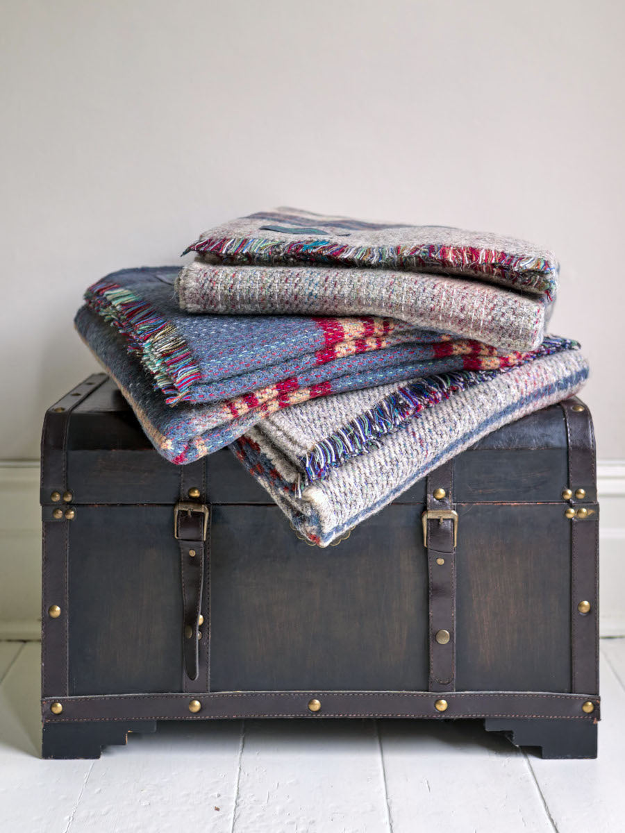 Stack of random recycled rugs from The British Blanket Company