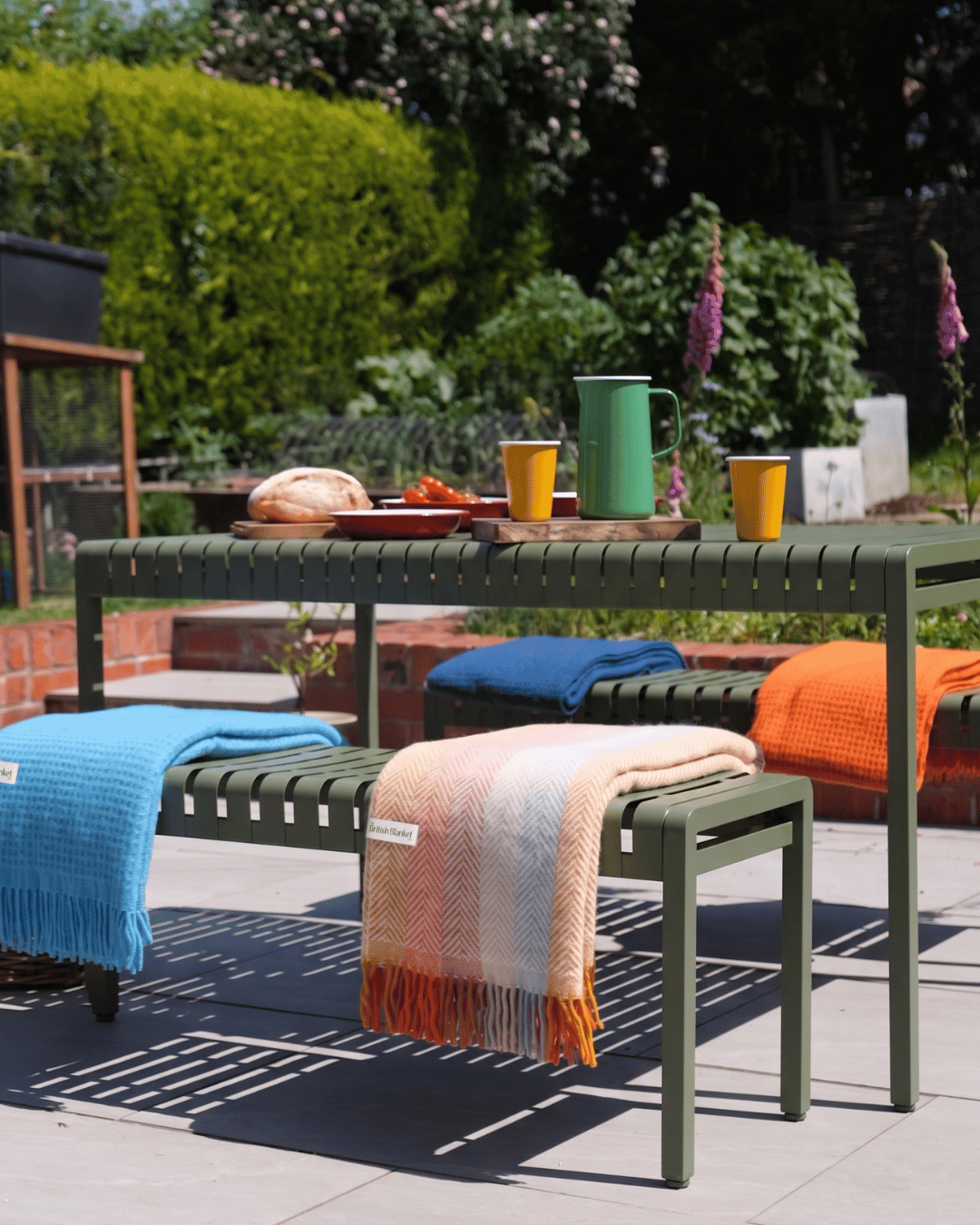 Outdoor summer garden lunch, with British Blankets and the Falcon enamel collection
