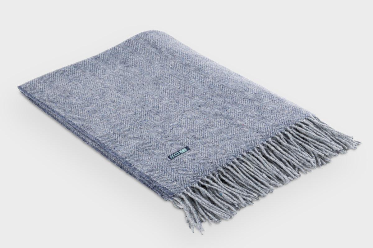 Folded blue Cashmere and Merino Recycled Wool Blanket by Turtle Doves for The British Blanket Company