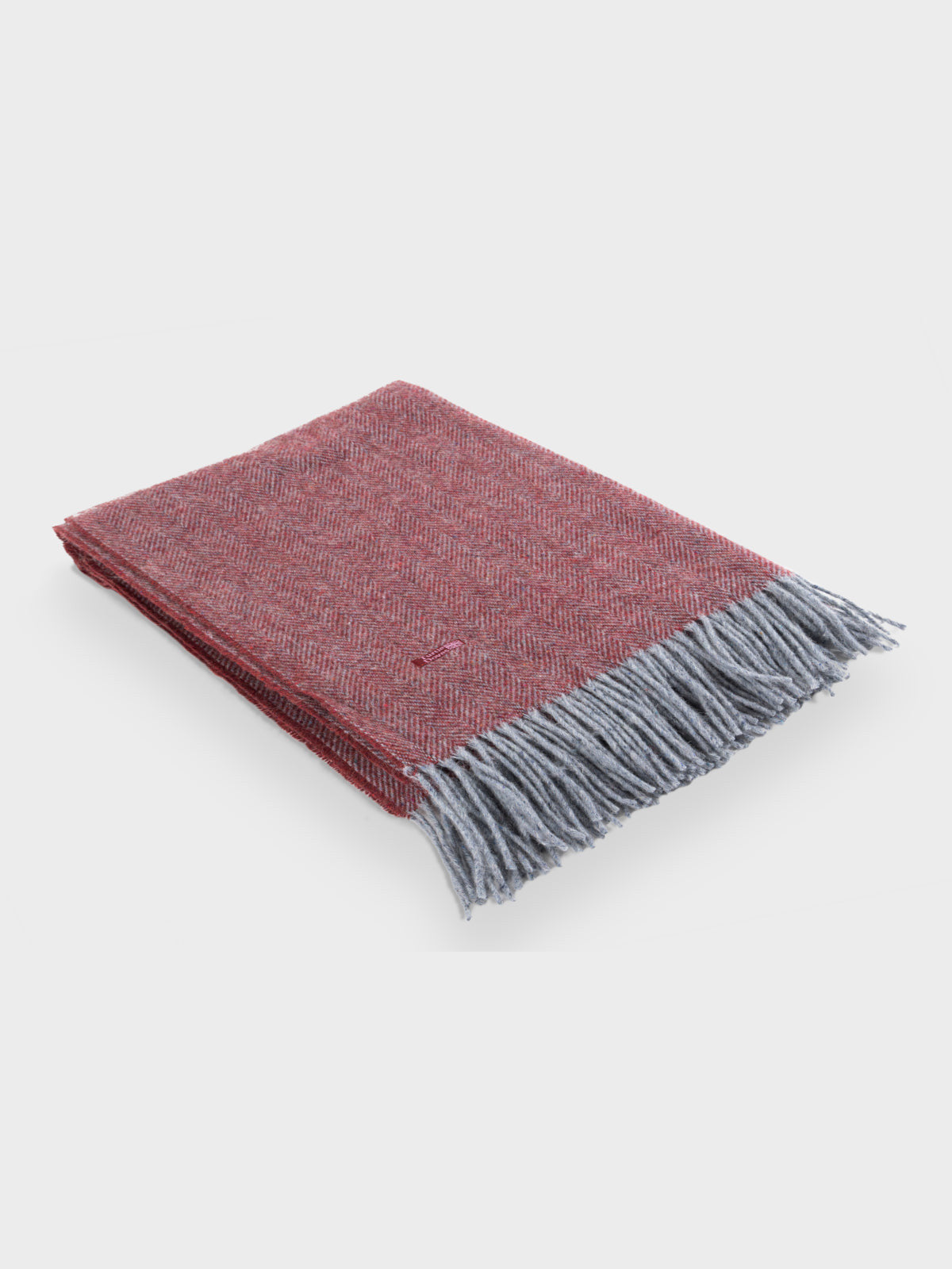 Folded Brick Red Cashmere and Merino Recycled Wool Blanket Turtle Doves at The British Blanket Company