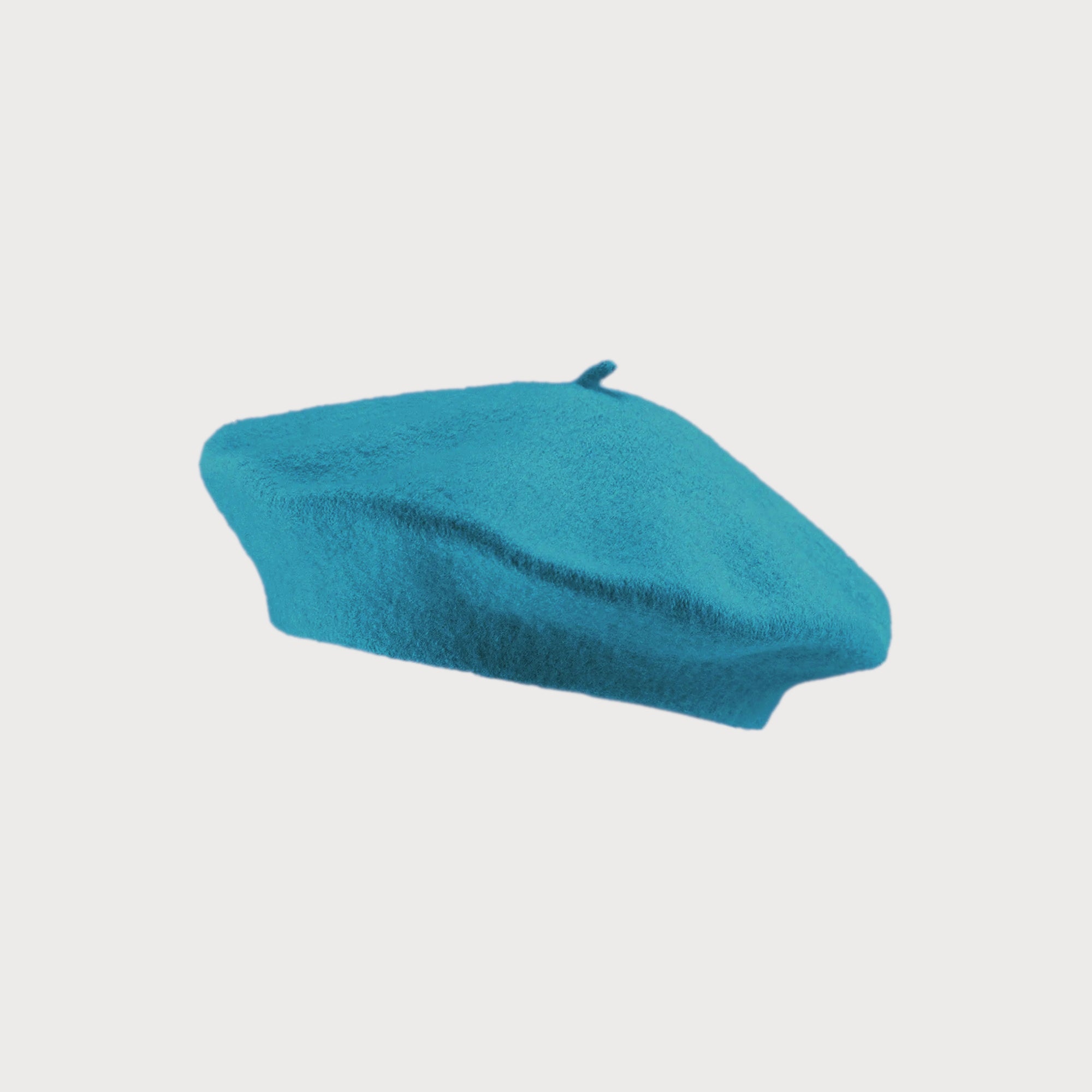 Teal Blue Wool Beret Hat, round and flat-topped, crafted from thick wool for warmth and elegance, fitting most adults up to 58cm circumference.