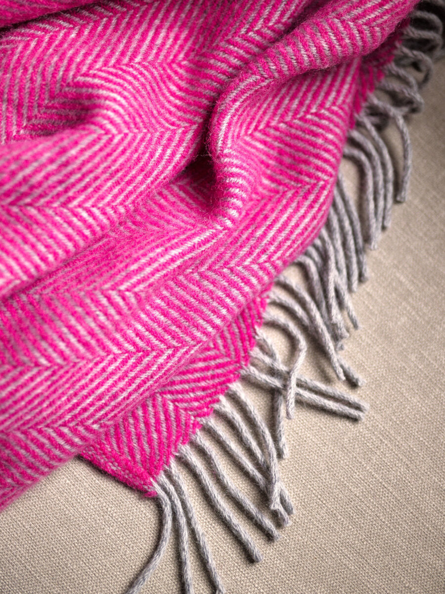 close up texture of Bright Pink and Grey Herringbone Throw by The British Blanket Company