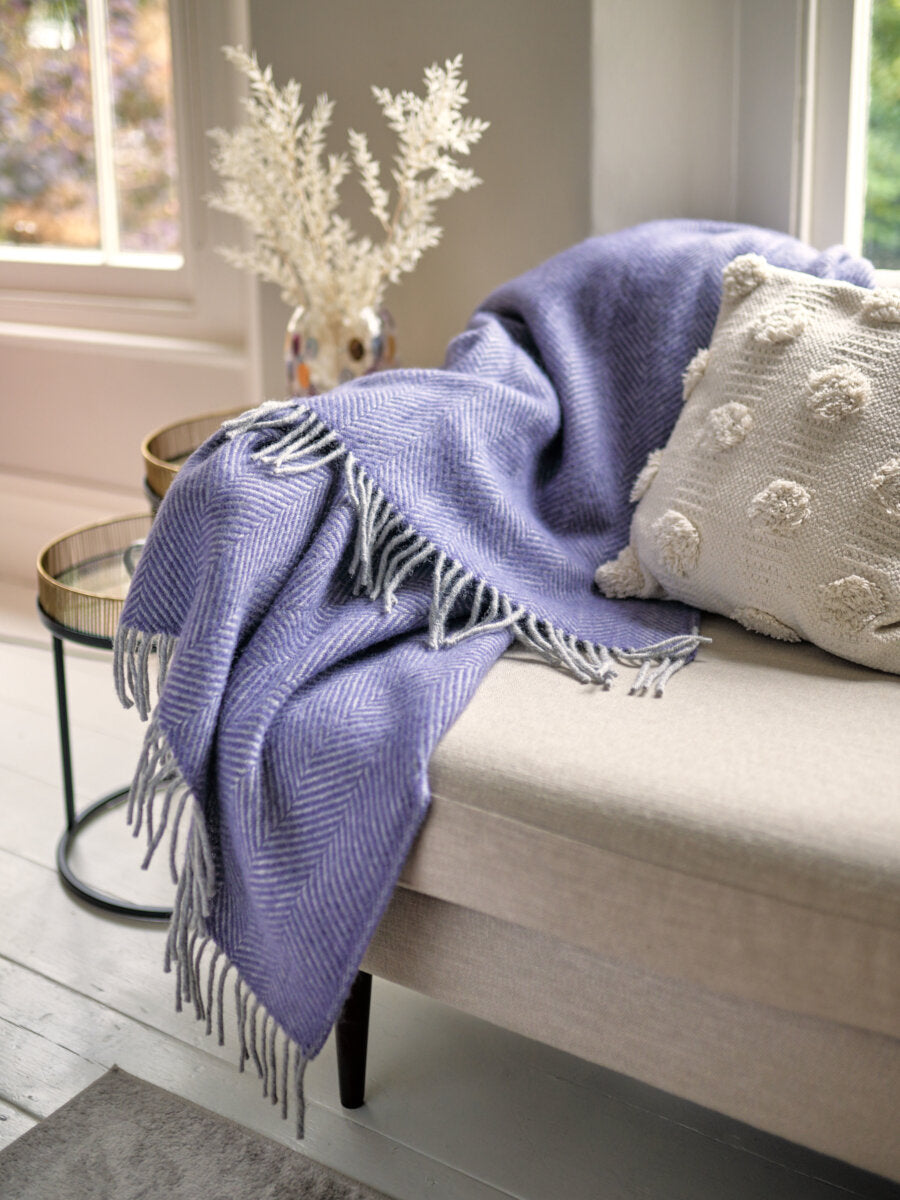 beige sofa with Lavender Purple and Grey Herringbone Throw by The British Blanket Company