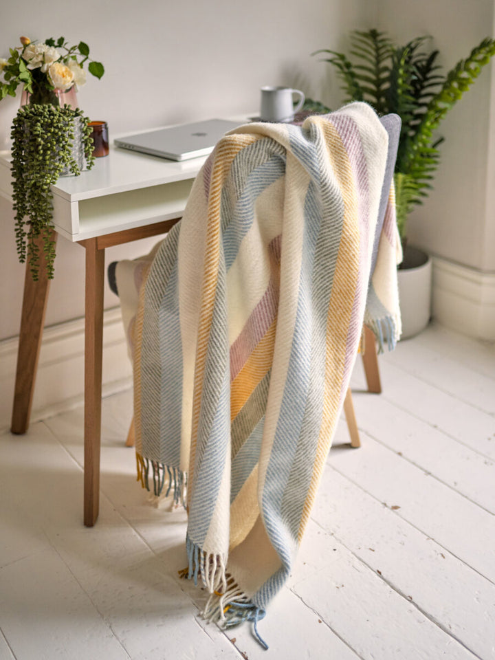 Work from home desk styled with Pastel Rainbow Stripe Herringbone Throw by The British Blanket Company