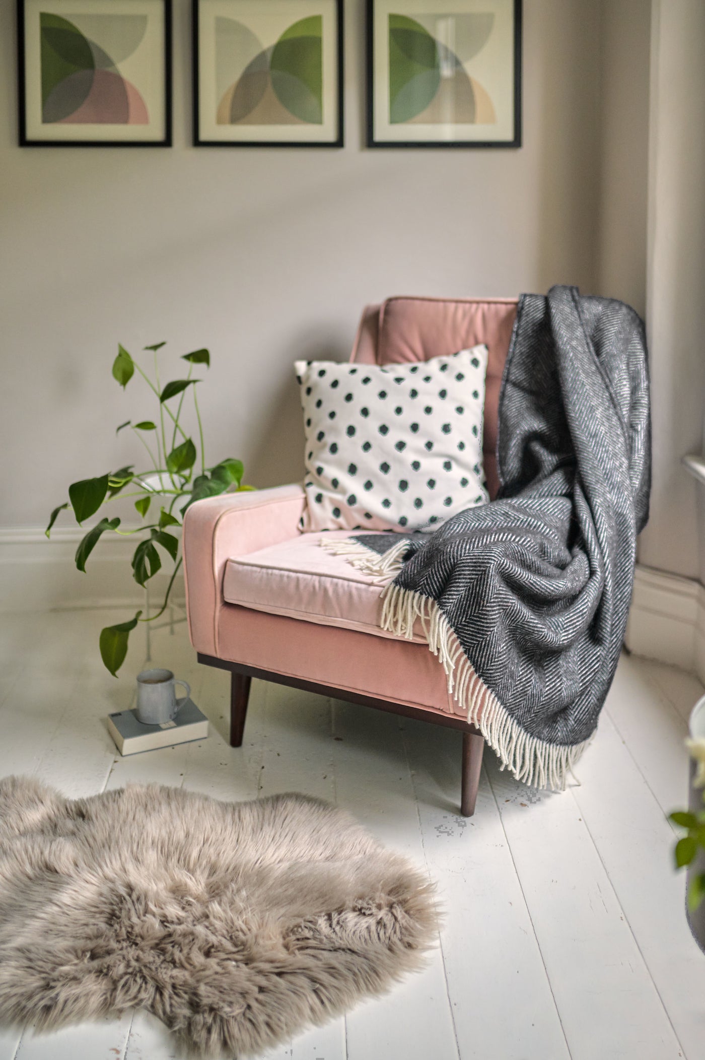 pink armchair styled with Black Herringbone Throw by The British Blanket Company