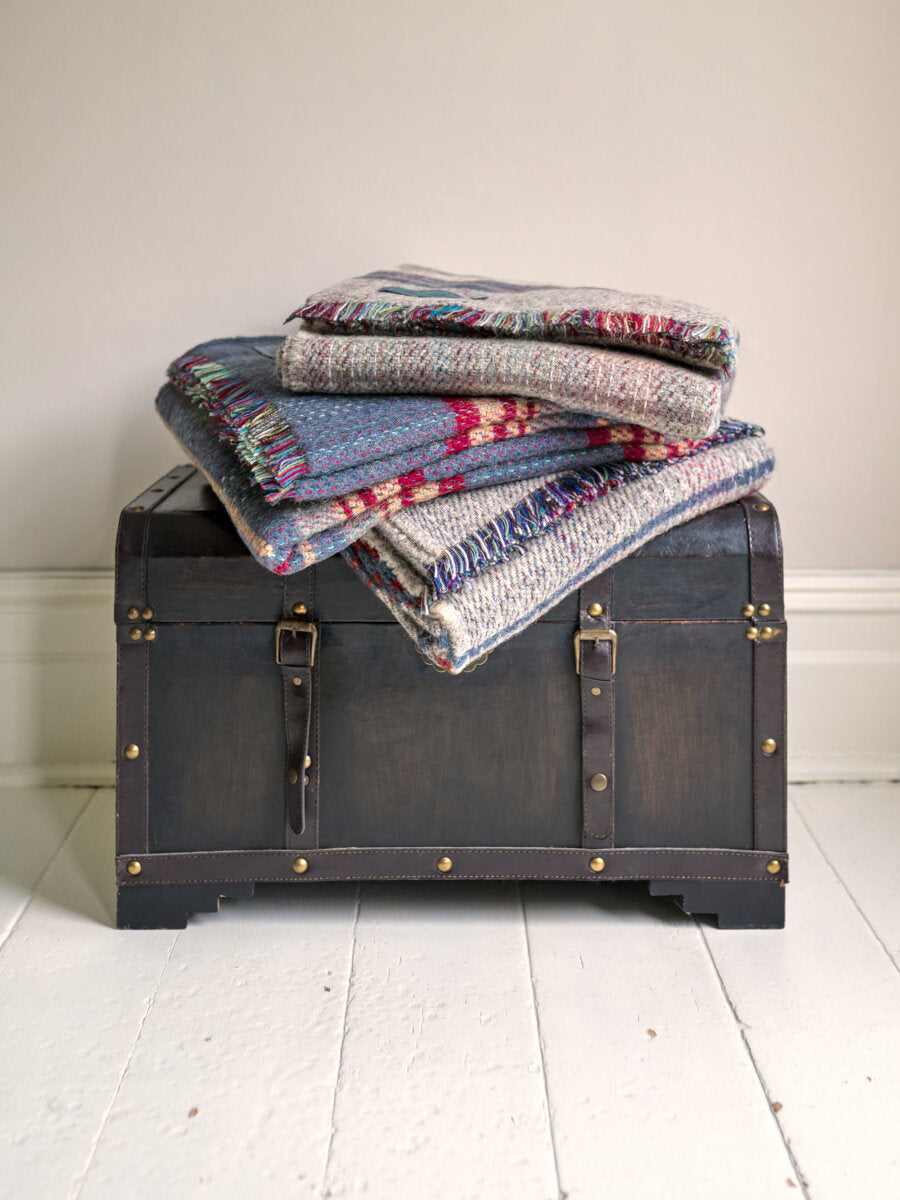 antique chest with pile of Random recycled wool throw blanket - The British Blanket Company