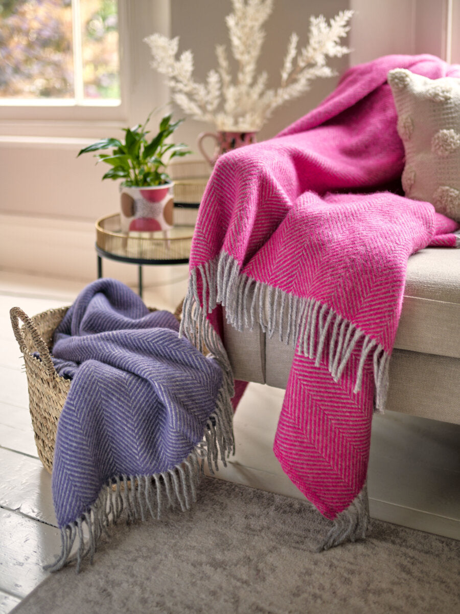 beige living room styled with lavender blanket and Bright Pink and Grey Herringbone Throw by The British Blanket Company
